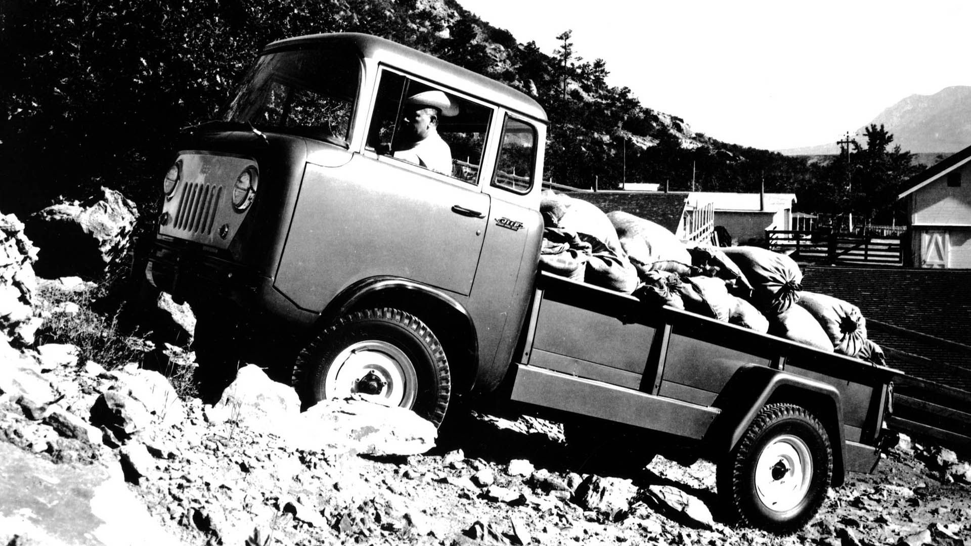 1957 Jeep FC170 driving on a trail