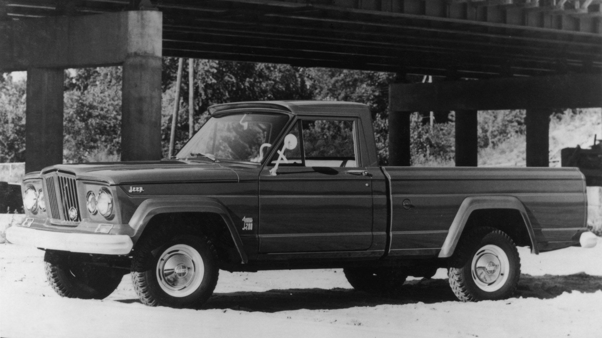 A 1963 Jeep Gladiator SJ parked