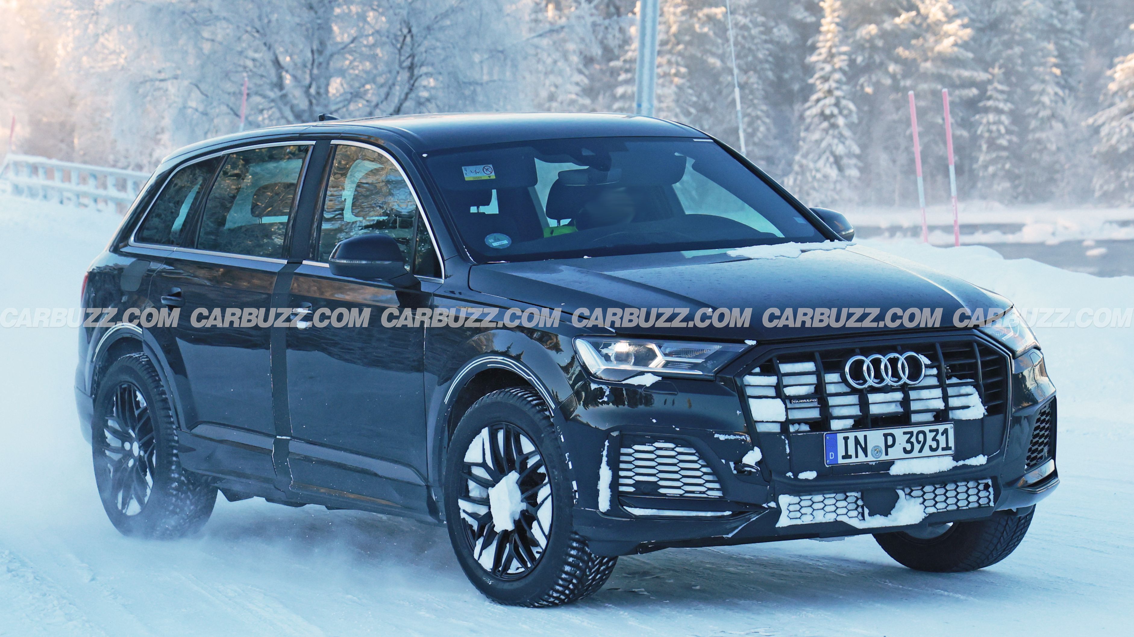 Audi Q9 test vehicle on a snowy road