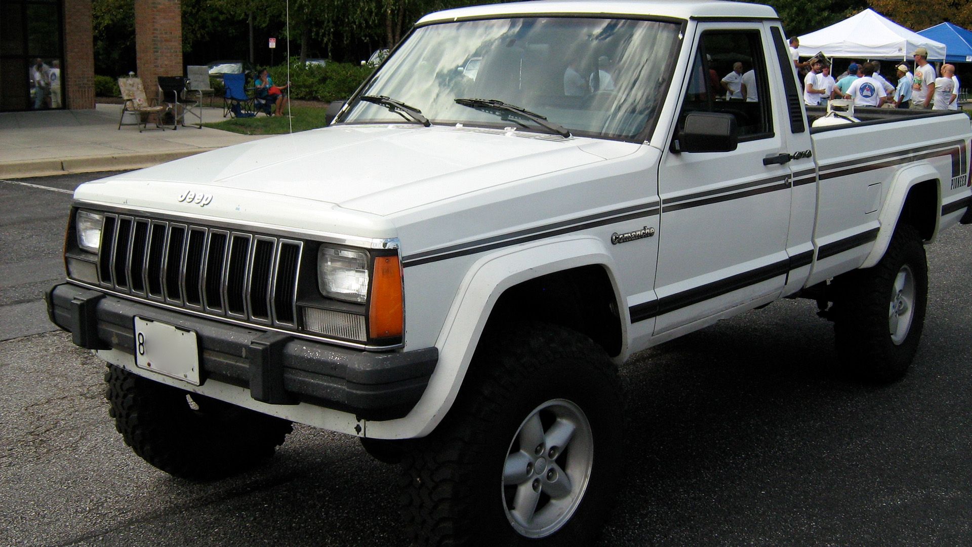 A white Jeep Comanche Pioneer