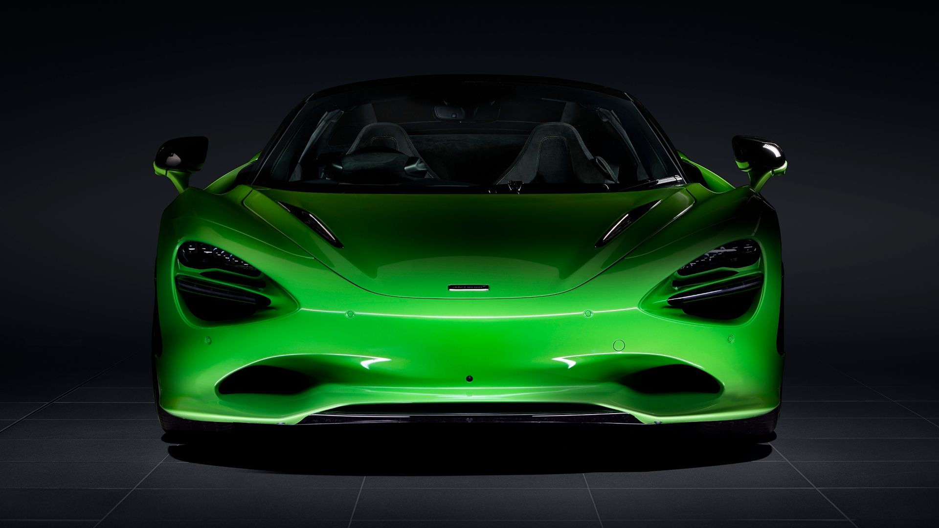 The front end of a green McLaren 750S