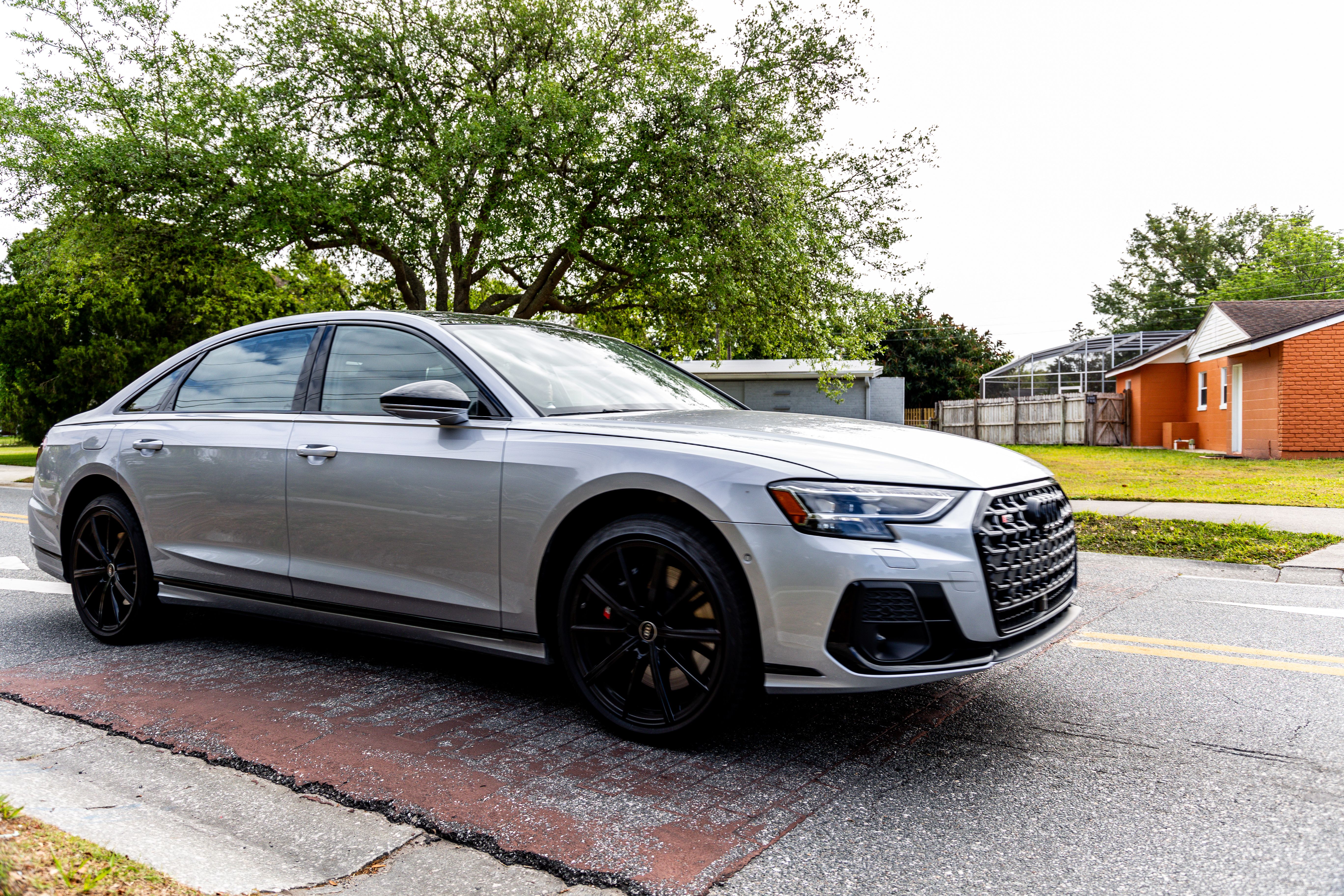 2024 Audi S8 rolling over a speed bump