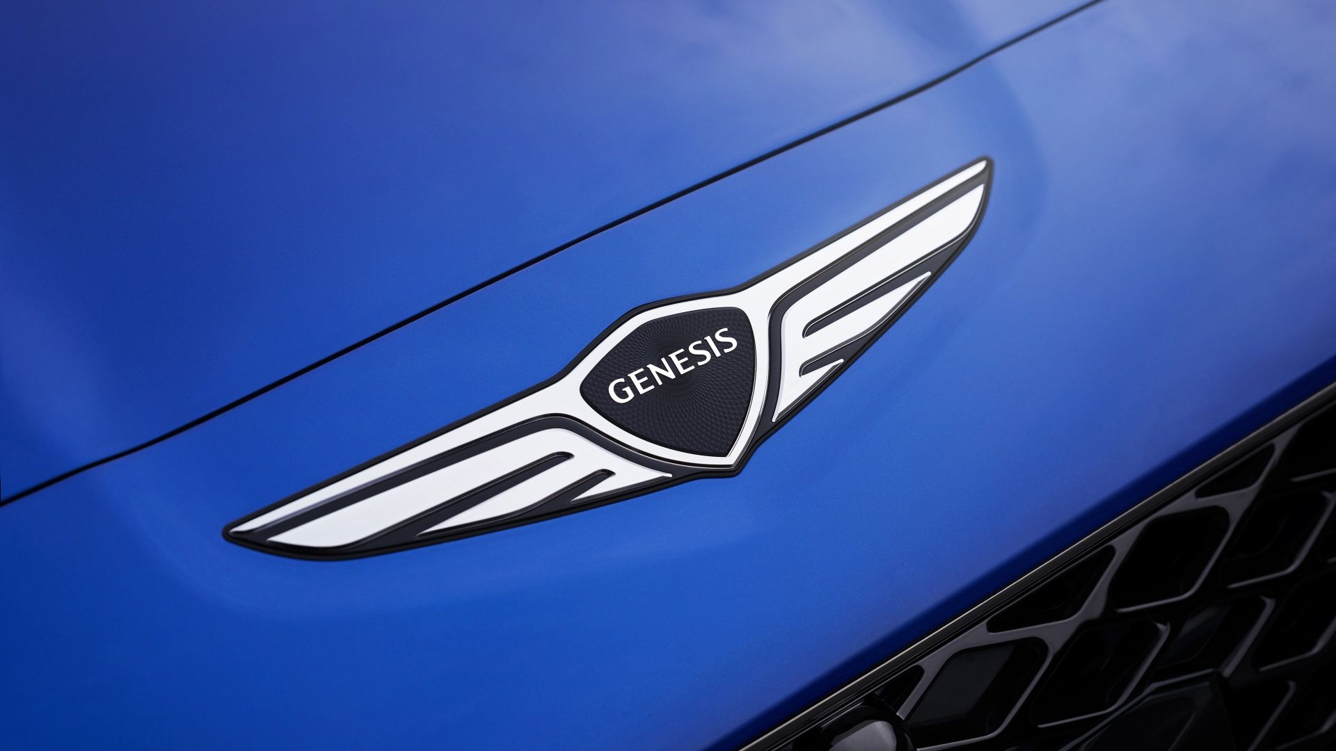 Genesis Badge On a blue Genesis G70 sedan