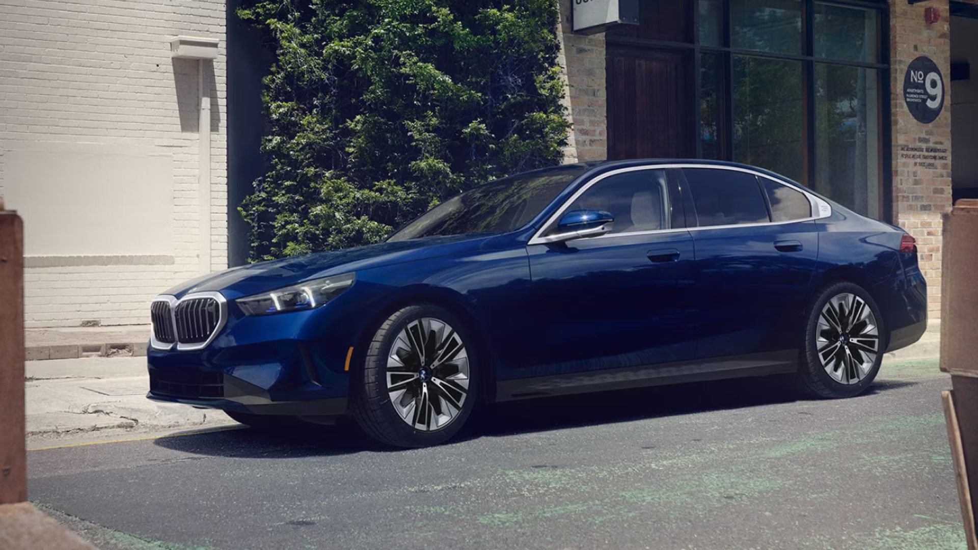 2024 BMW 540i x Drive, front quarter view, blue