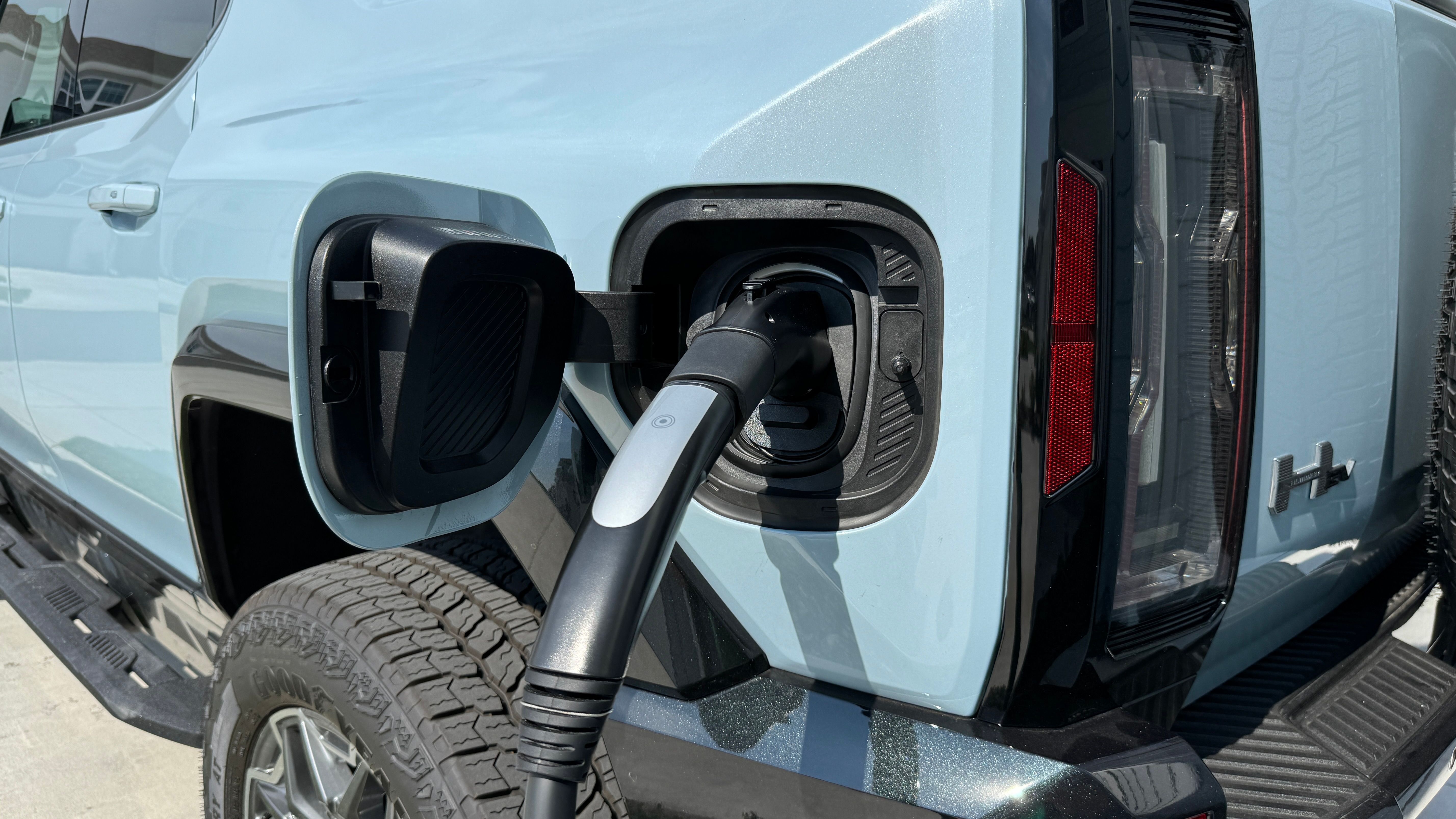 2024 GMC Hummer EV SUV plugged in