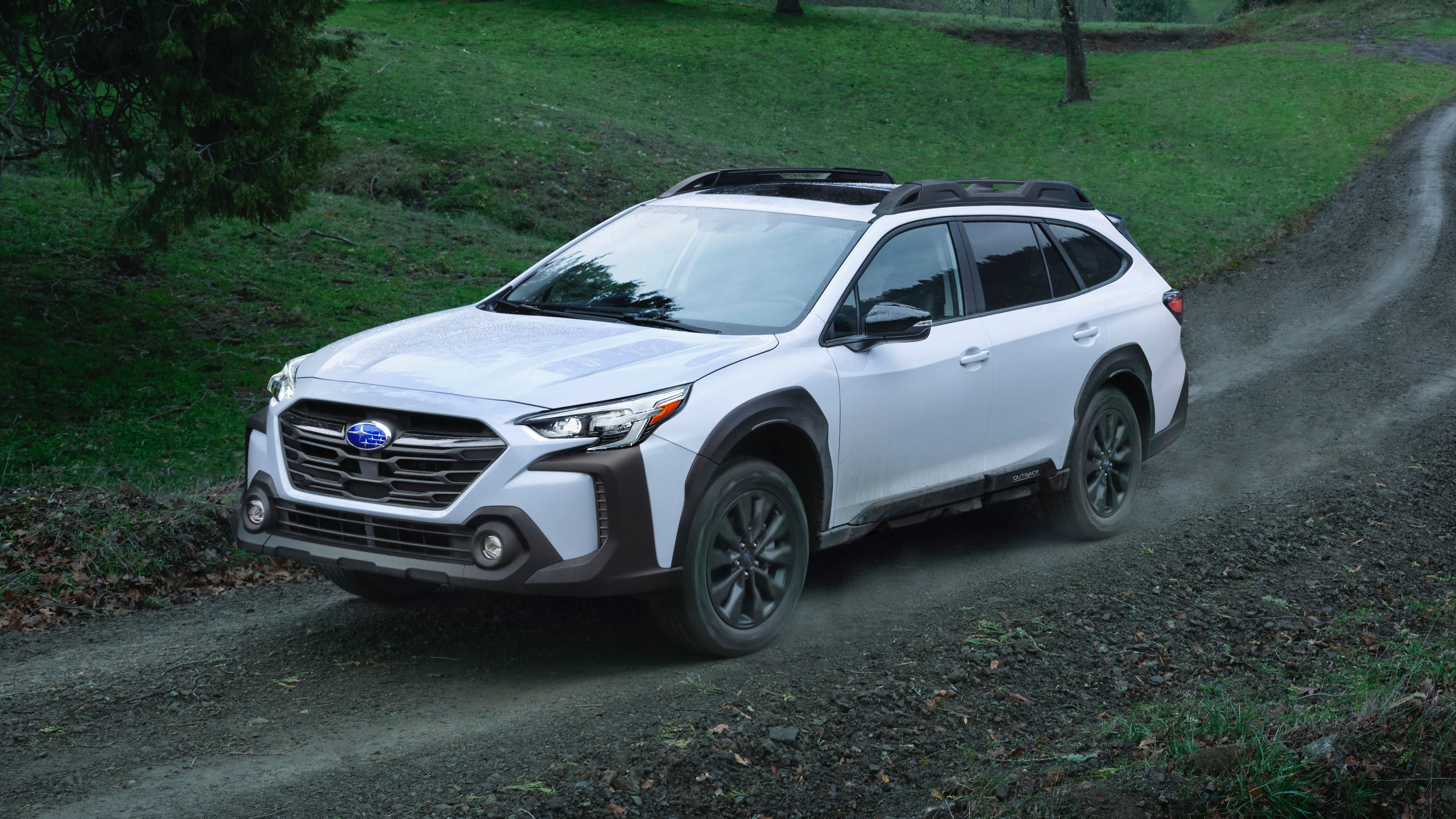 Subaru Outback white Driving on Gravel