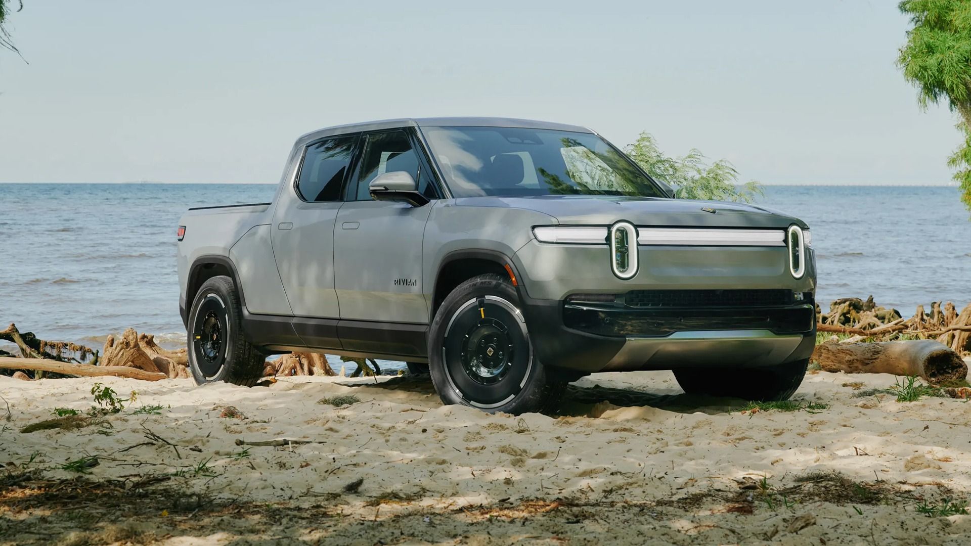 2025 Rivian R1T Gray Front Angle on Beach