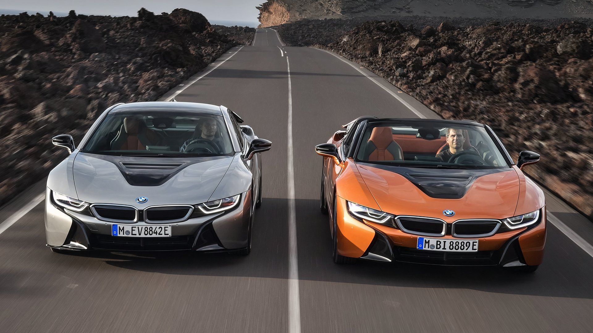 BMW i8, front quarter view of model next to other model in distance