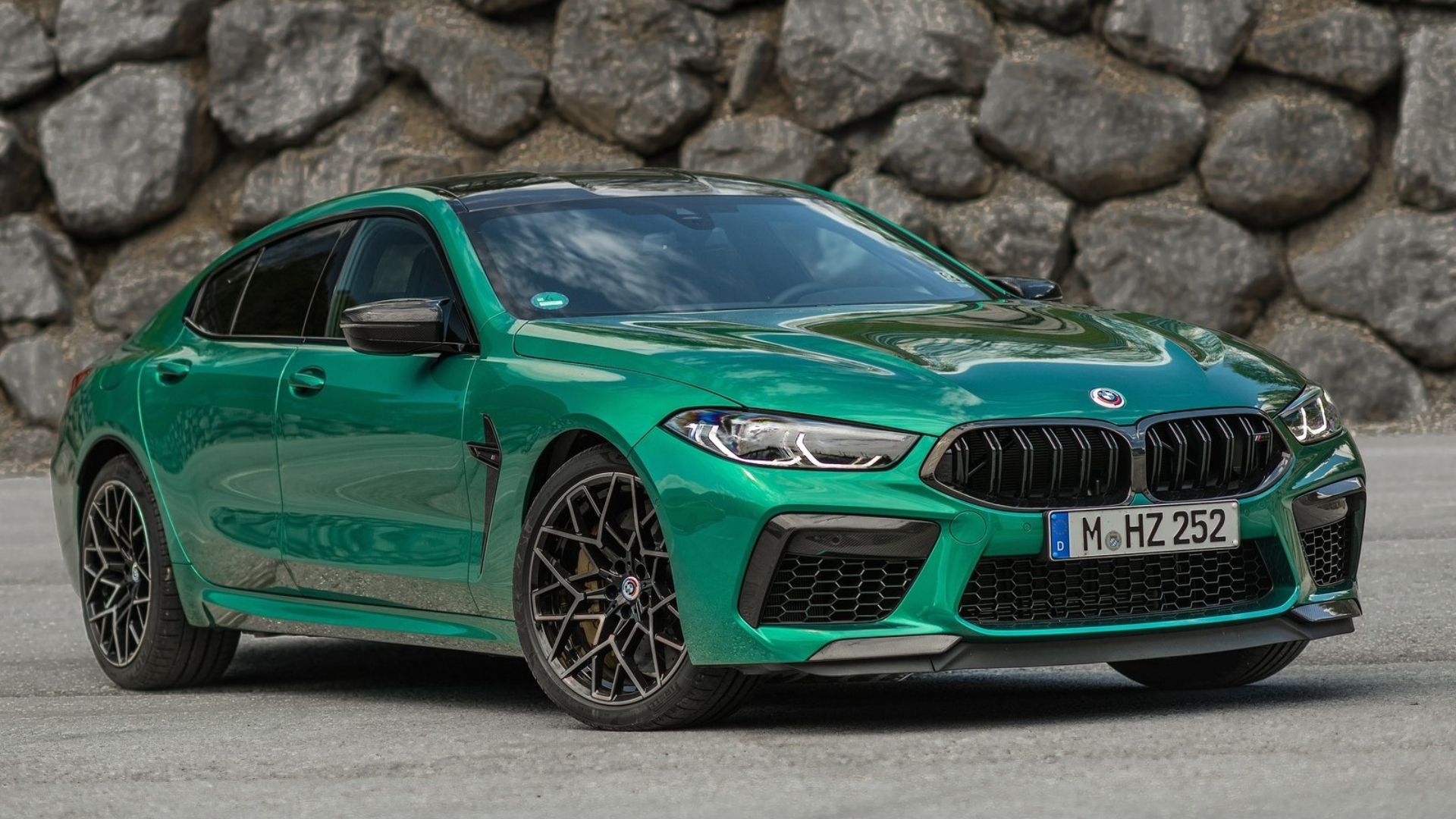 bmw m8 competition gran coupe front quarter green