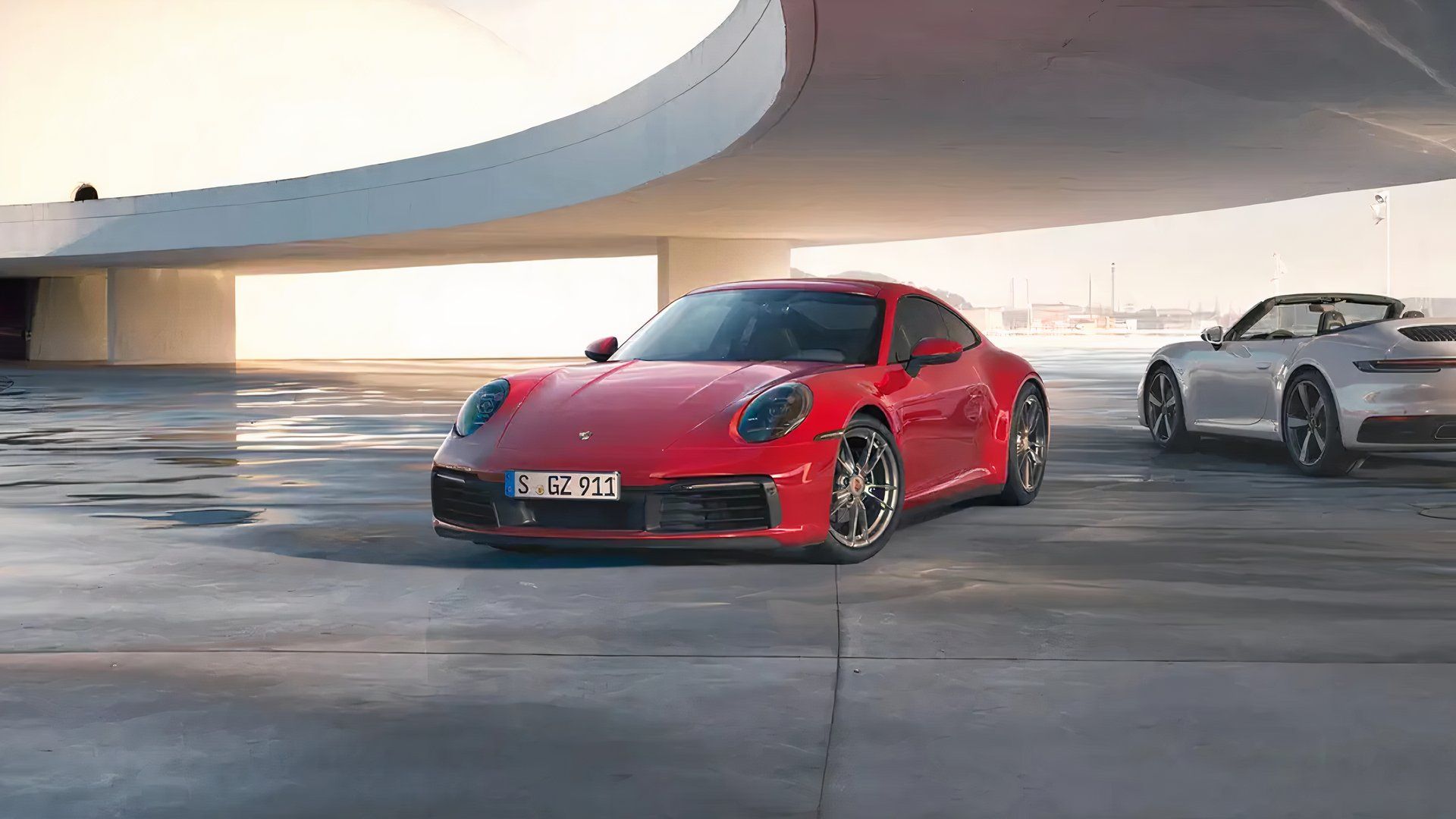 2024 Porsche Carrera, front quarter view, red, near other Porsche outside