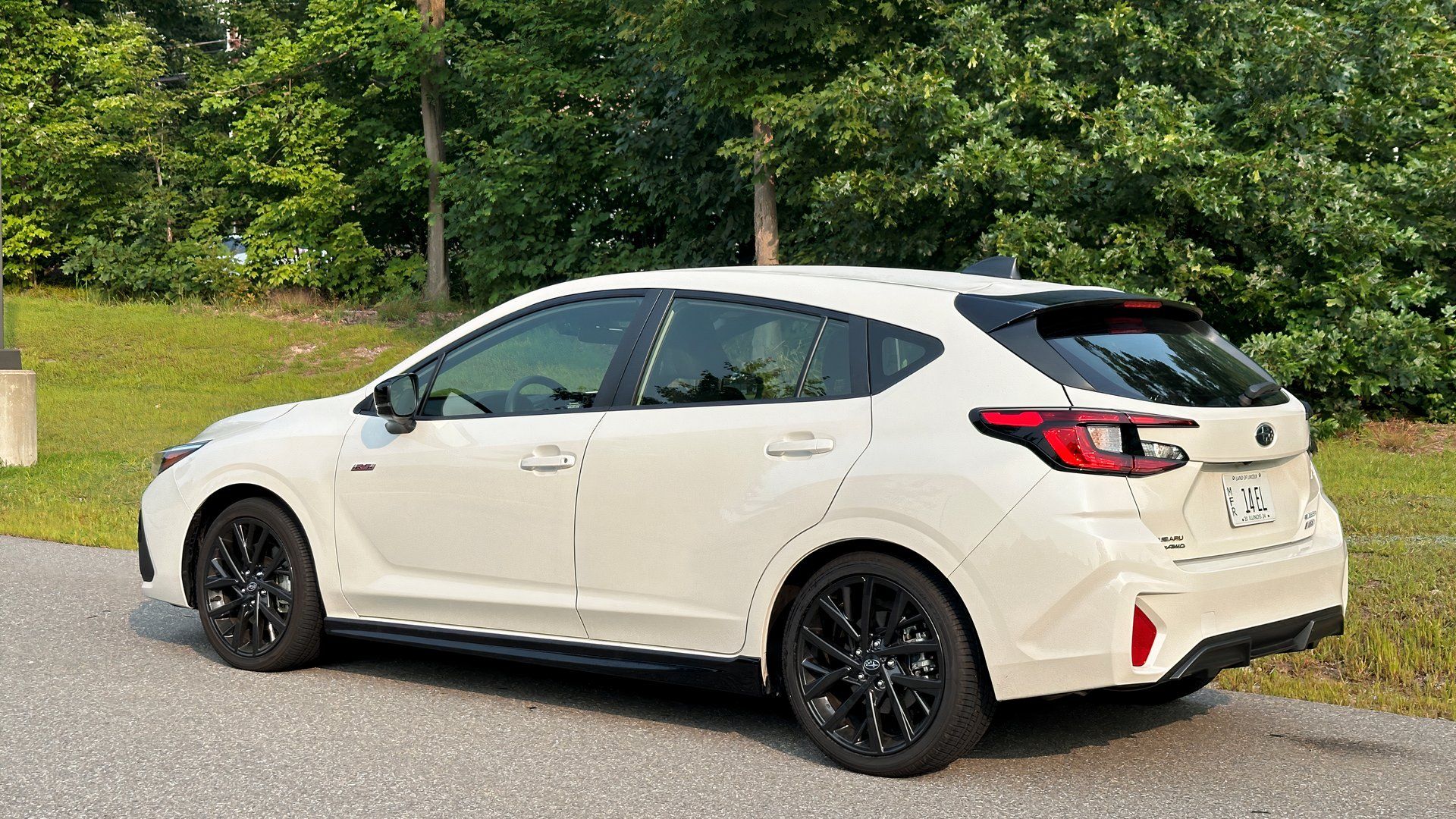 A rear quarter view of the 2024 Subaru Impreza