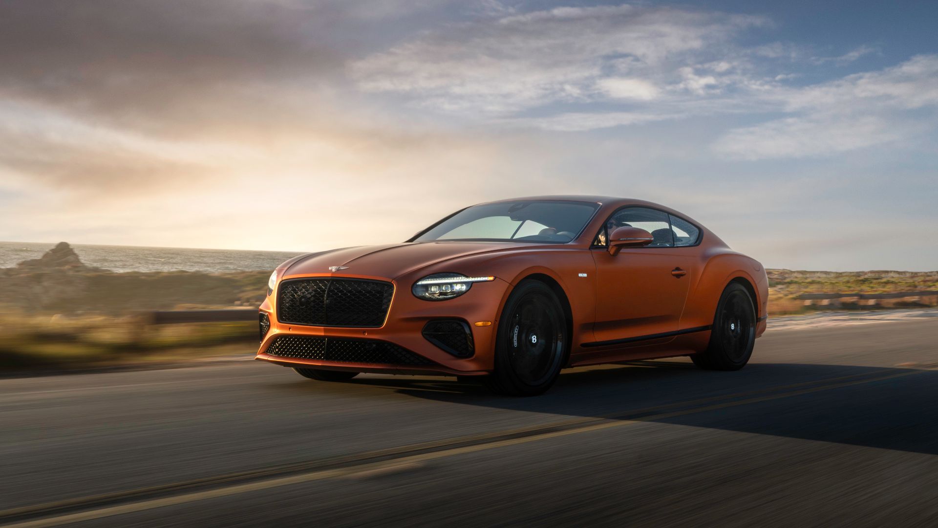 2025 Bentley Continental GT Speed Orange Front Angle Driving 