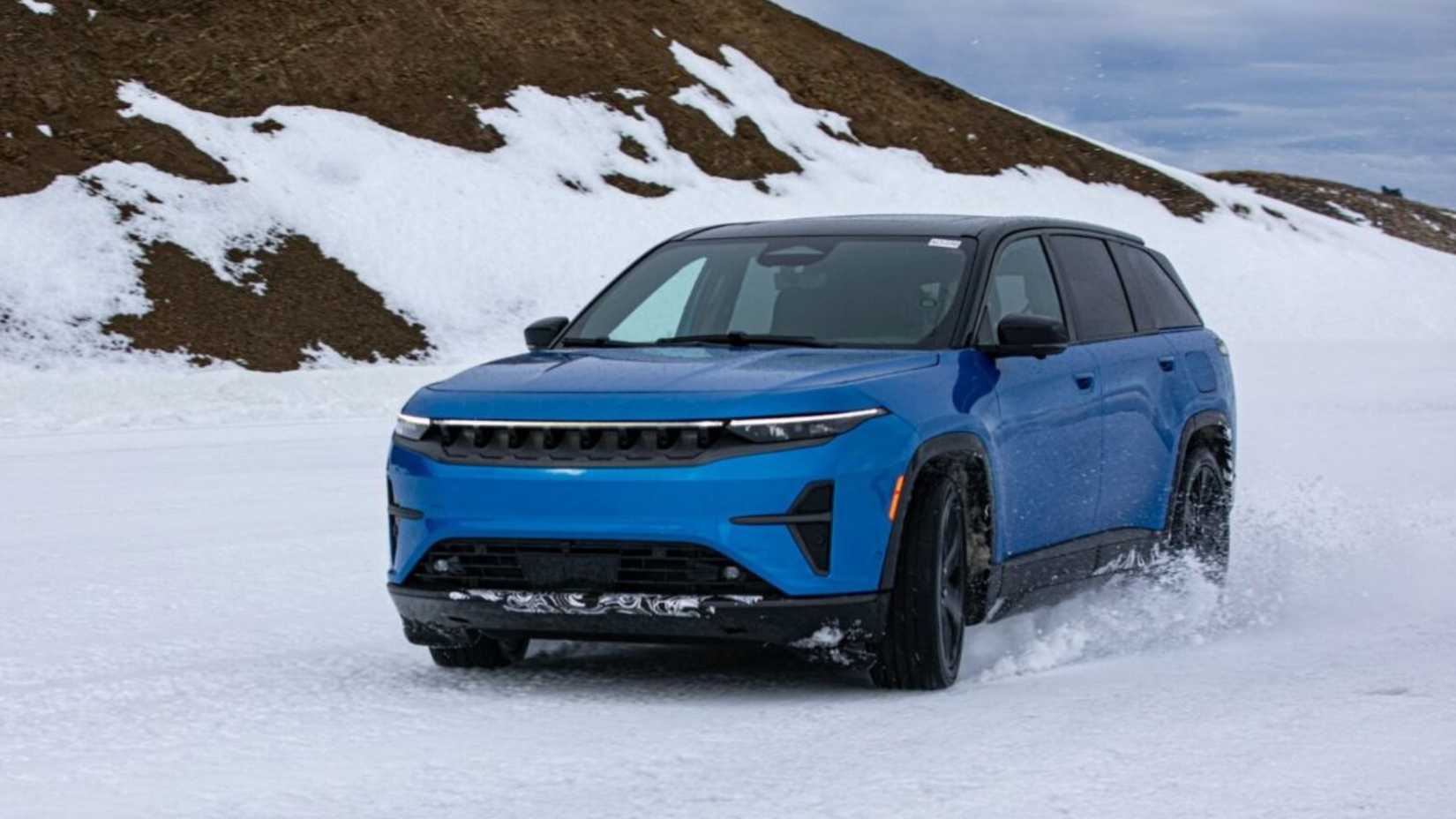 The Jeep Wagoneer S driving in snow