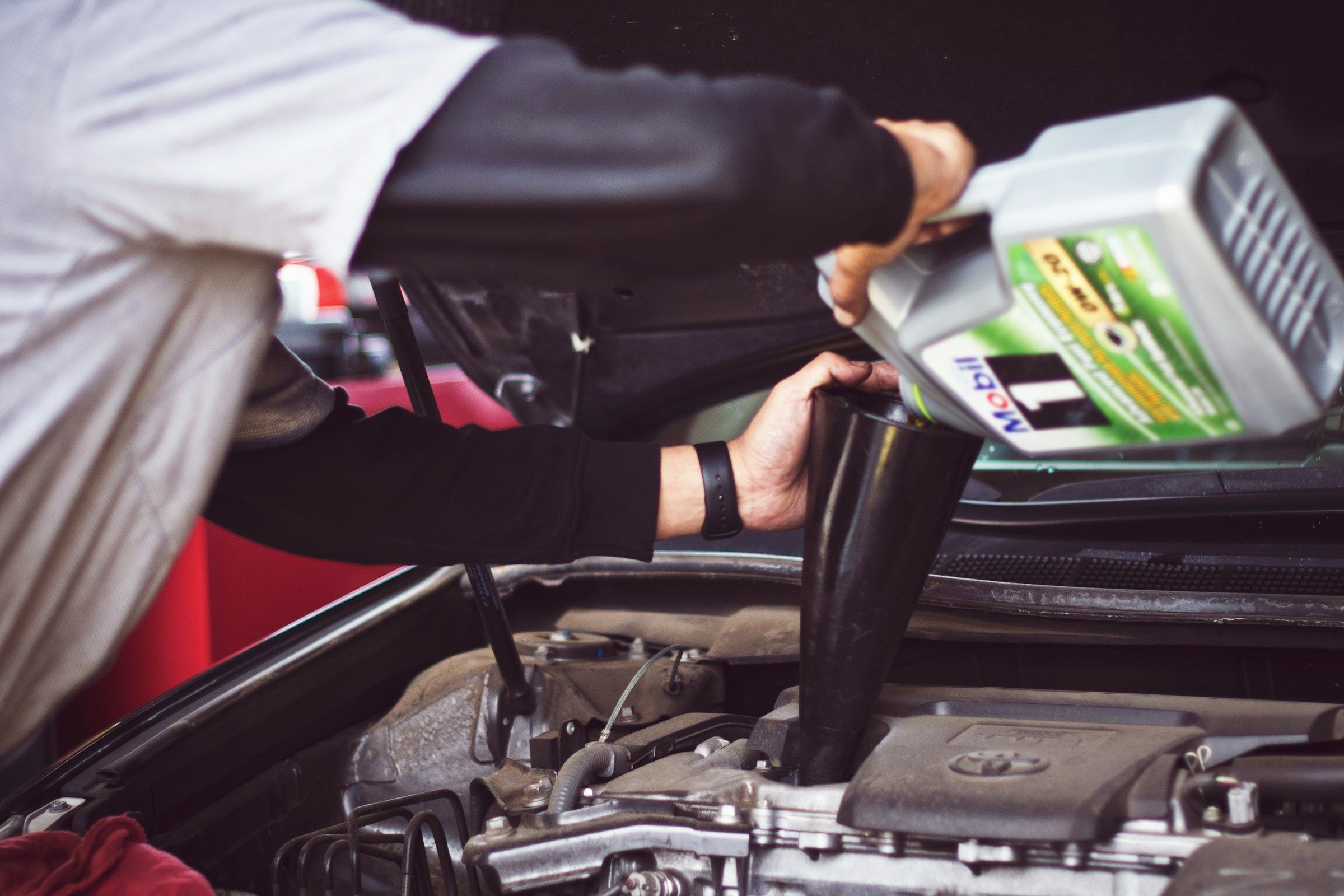 Car receiving new oil