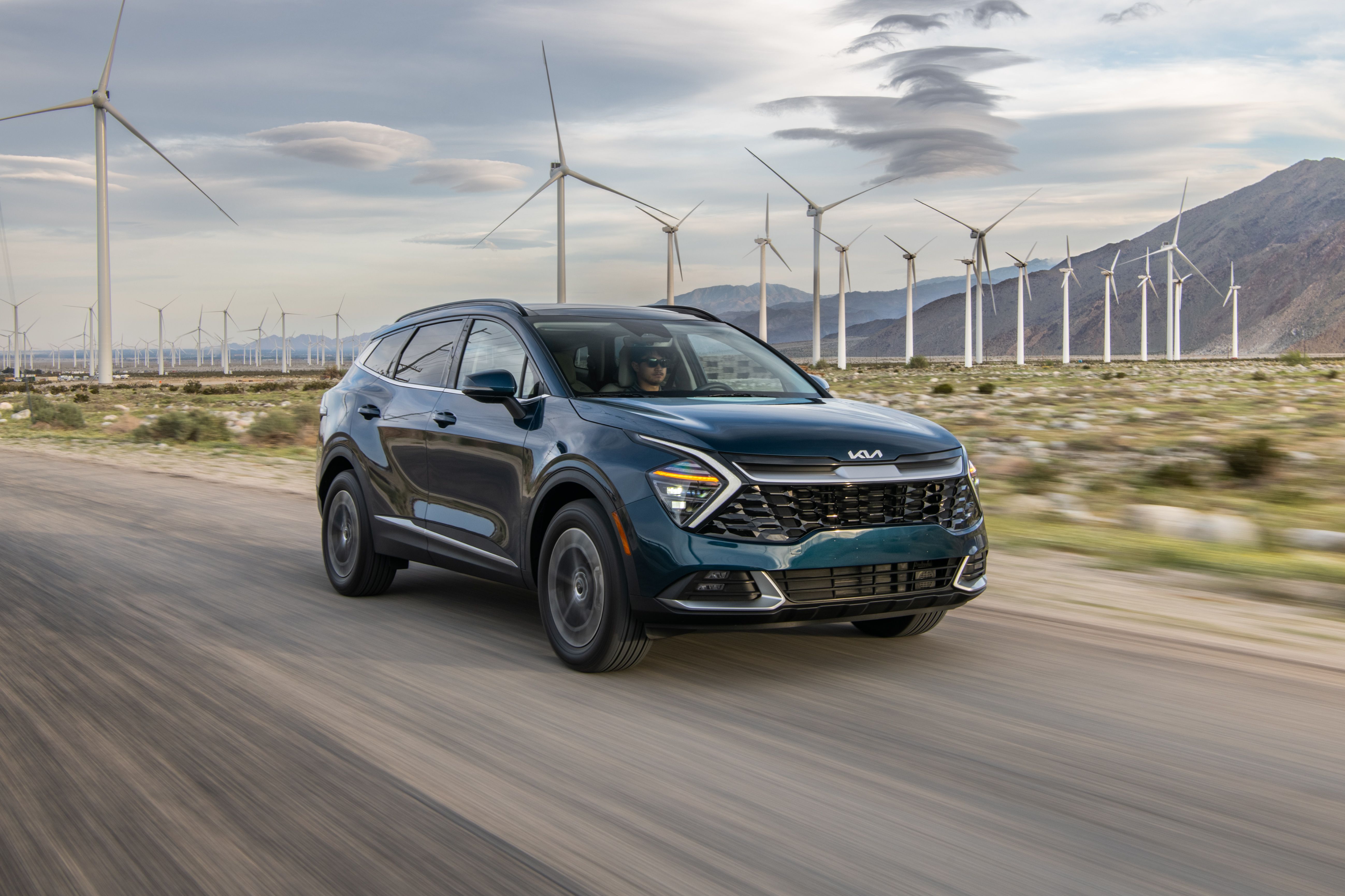 2025 Kia Sportage Hybrid driving on road