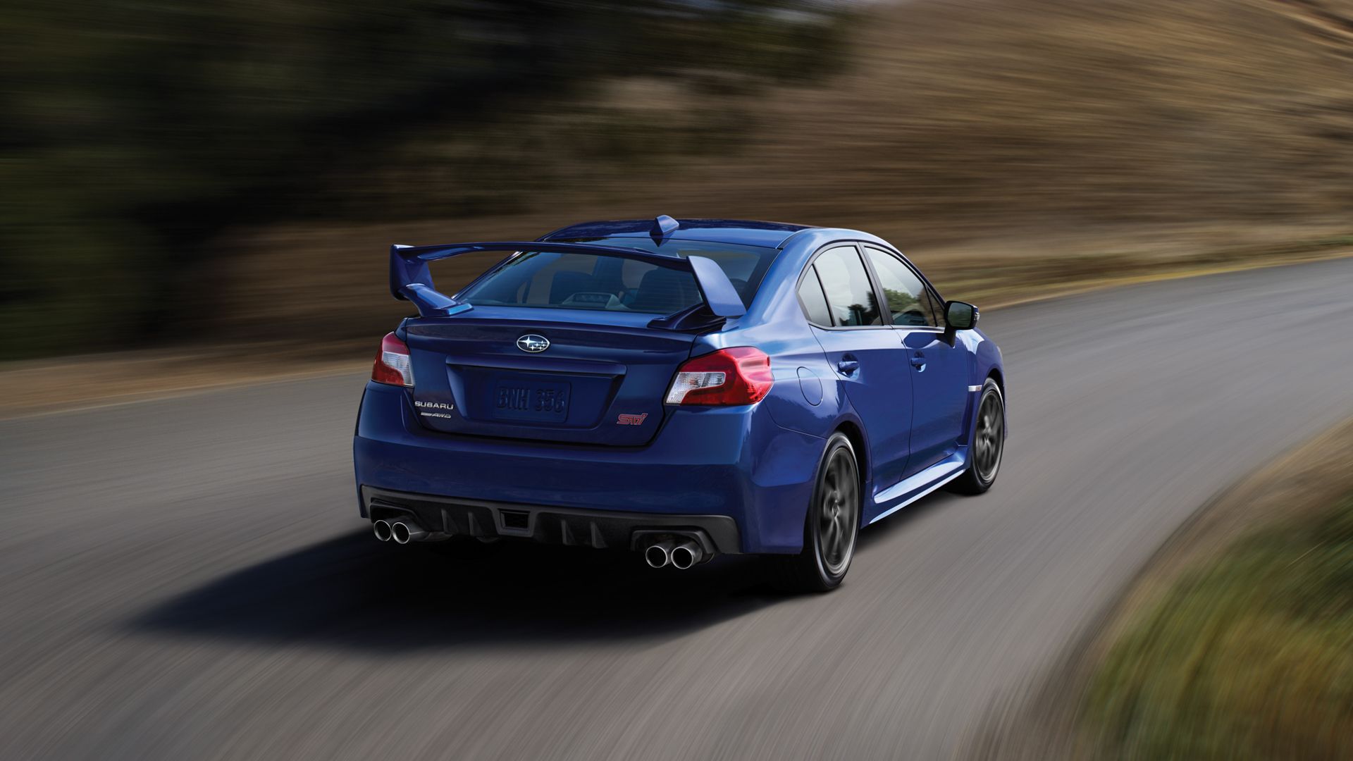 2017 WRX STI rear quarter rolling taking bend