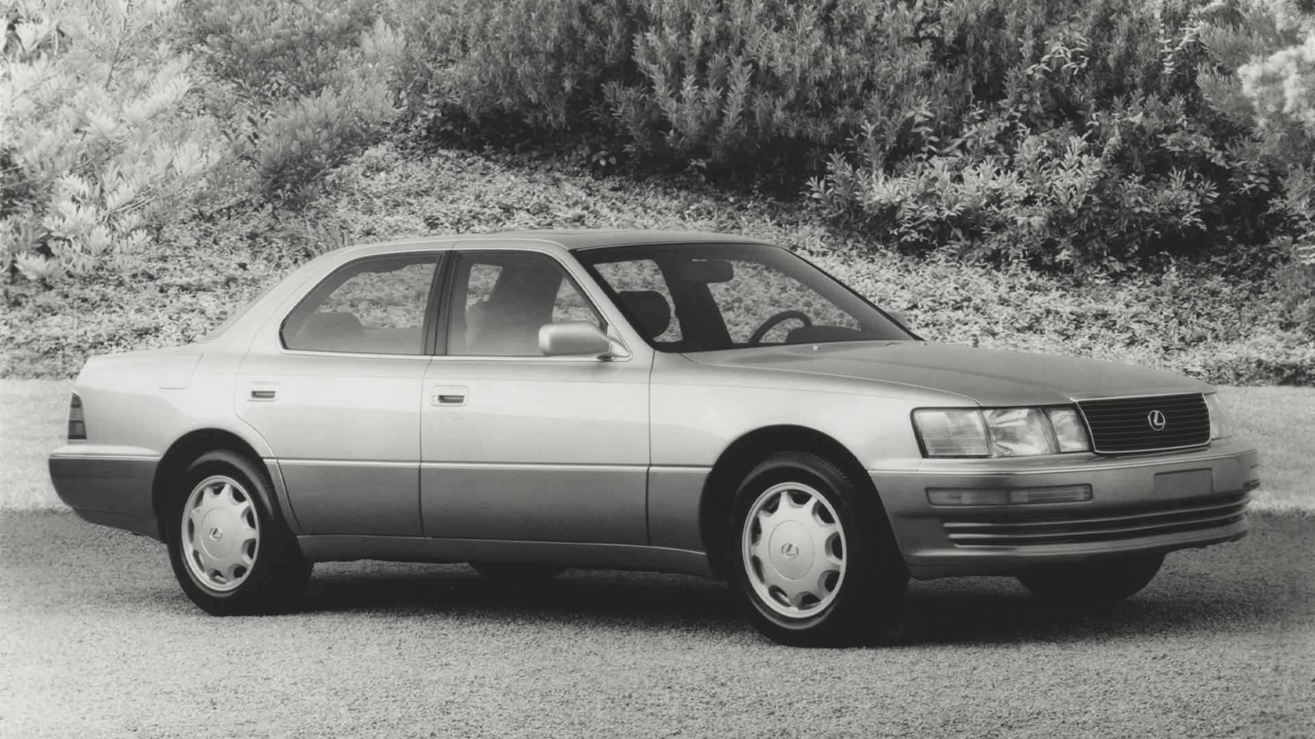 Black and White photograph of a 1993 Lexus LS 400 parked on the grass-1