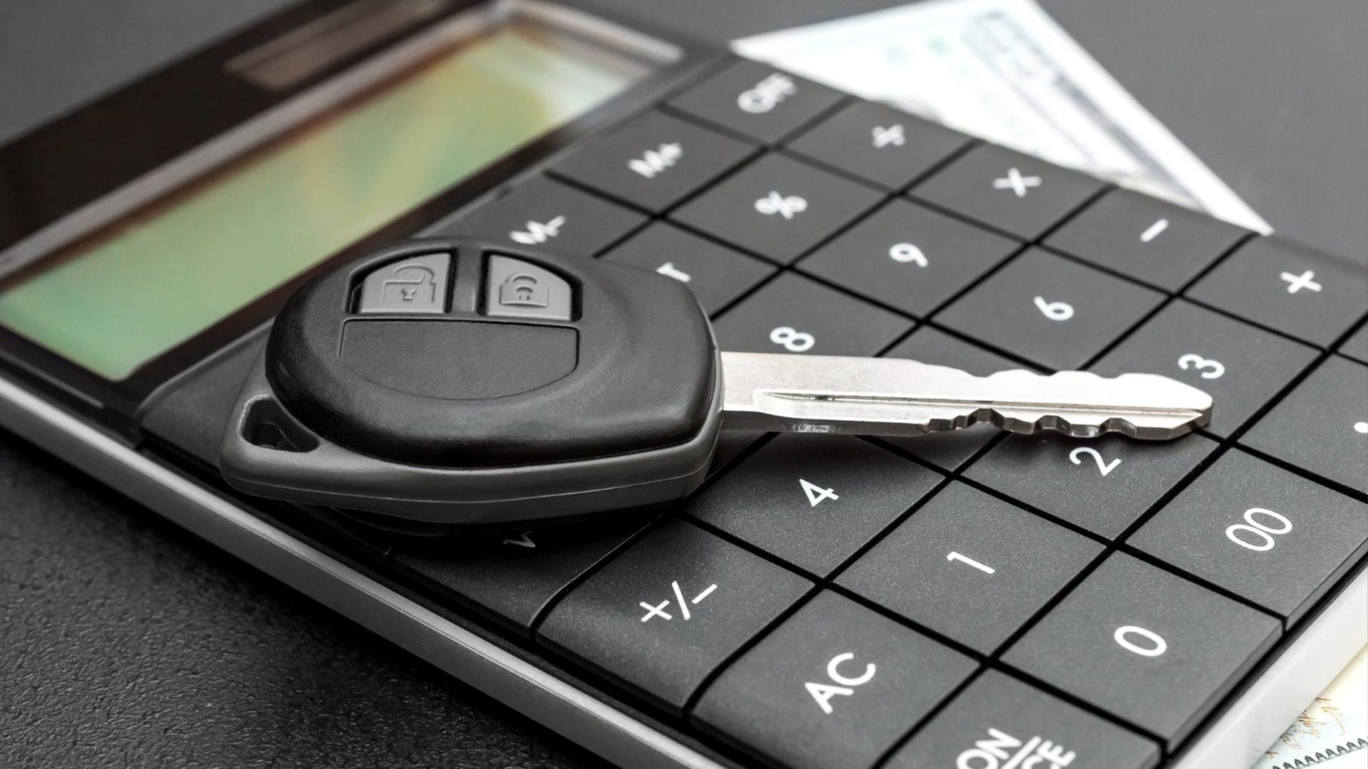 A Car Key And A Calculator