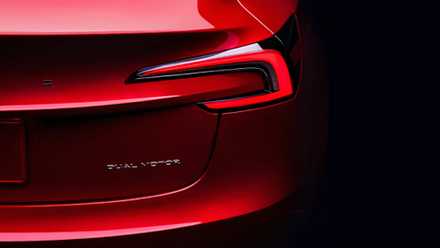 Red Tesla Model 3 rear badge