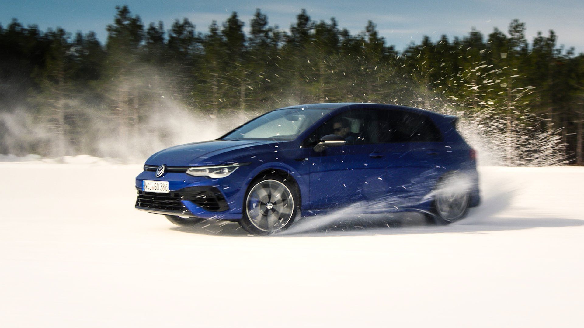 Volkswagen Golf R 2022 driving on snow rolling AWD