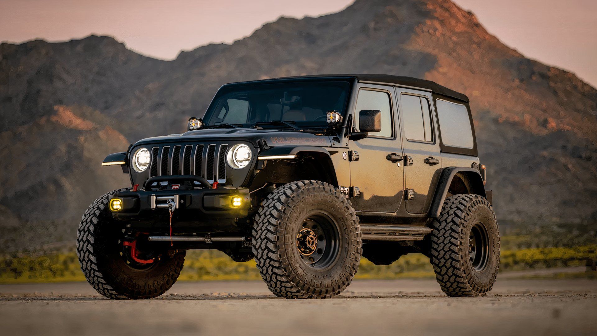 Heavily modified off-road JL-generation Jeep Wrangler front 1/4