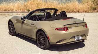 2024 Mazda MX-5 Miata Roof Down Gold Rear Angle