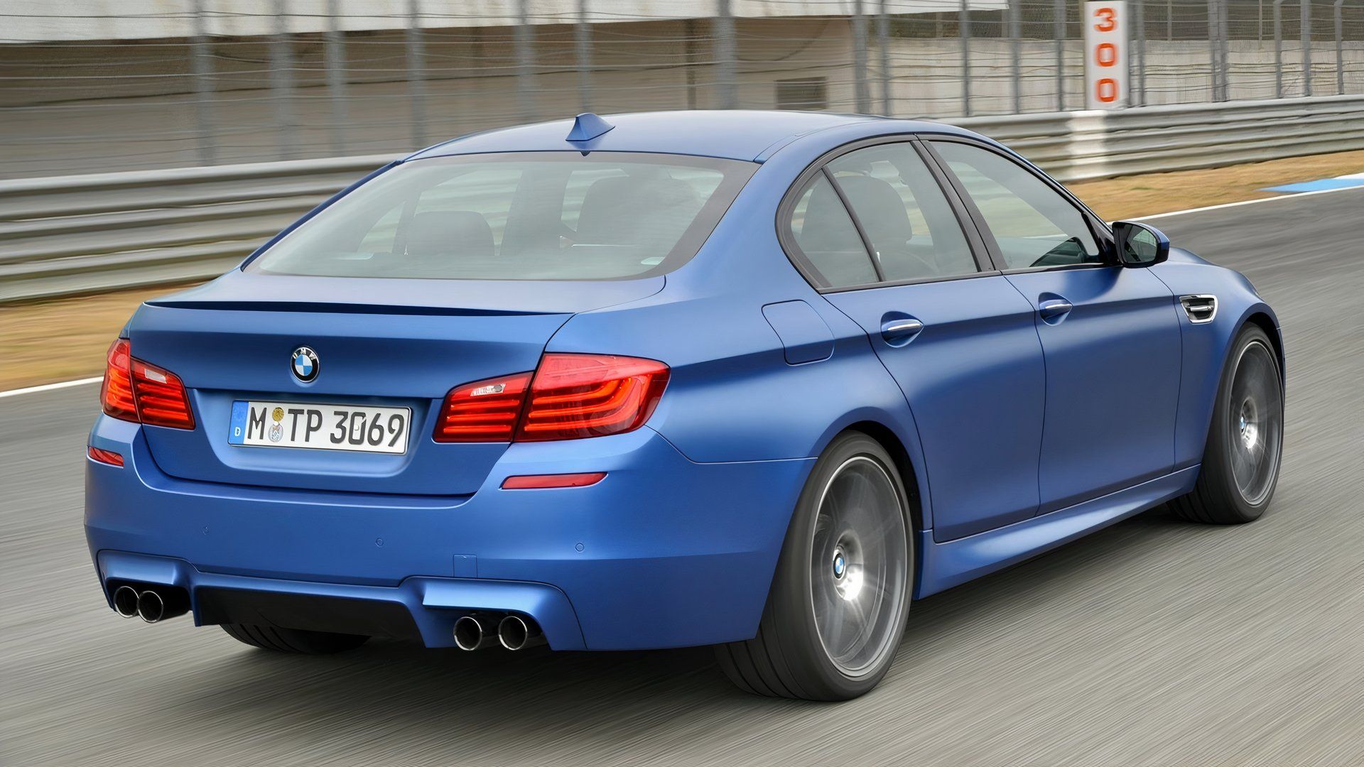 2014 BMW M5 F10 Blue Rear Angle Driving