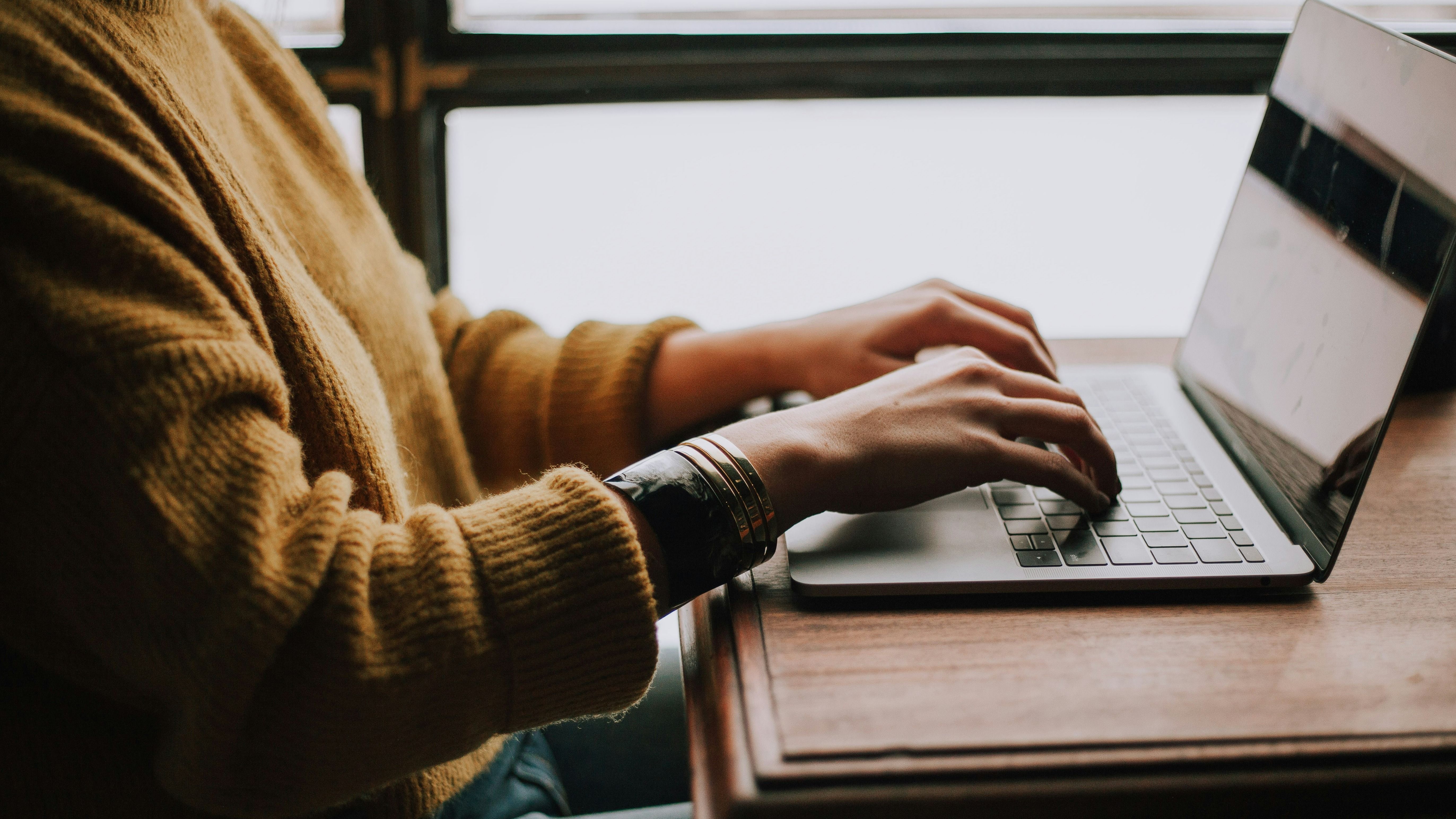 Person Working on Laptop Stock Photo