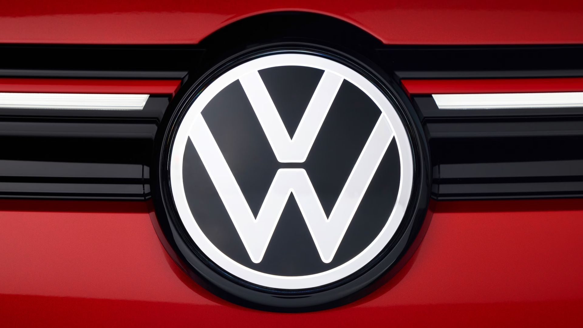 VW Badge On A Red Car