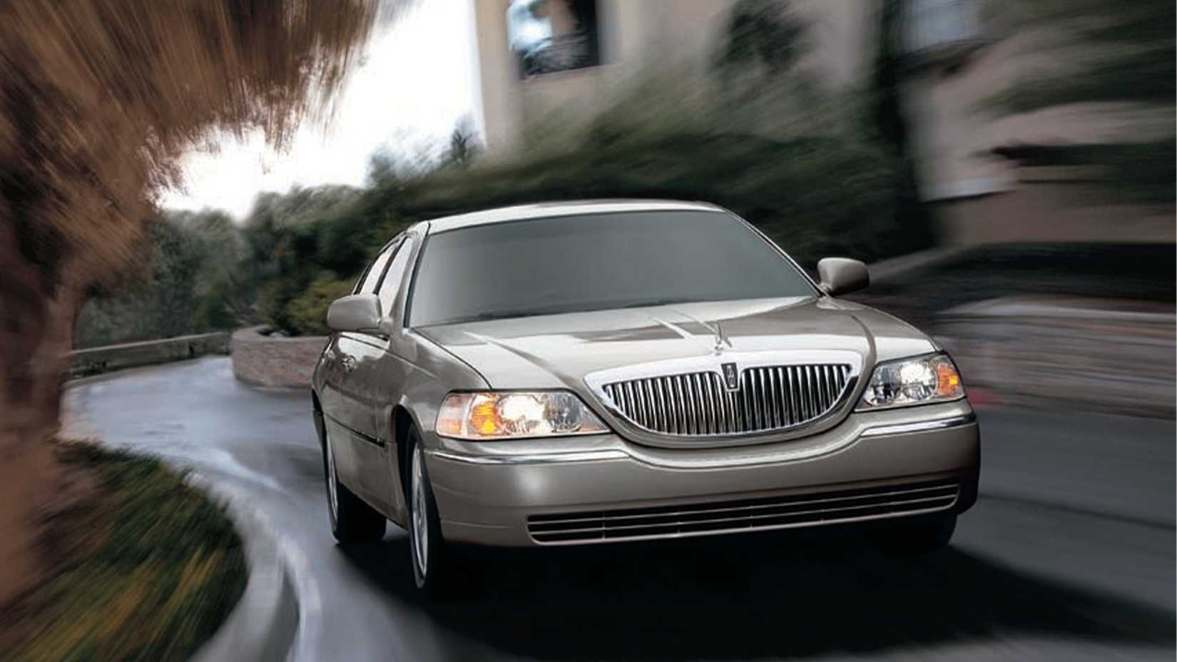 2009-2011 Lincoln Town Car Silver Front View Driving