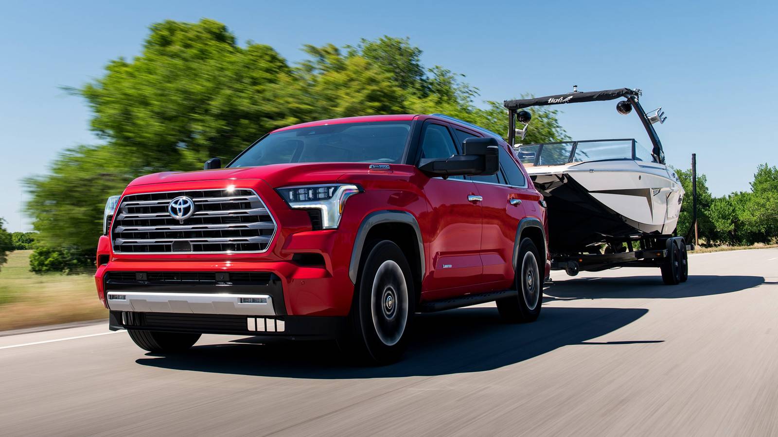 Modern SUV representing hybrid-capable crossover towing considerations for small campers or boat trailers