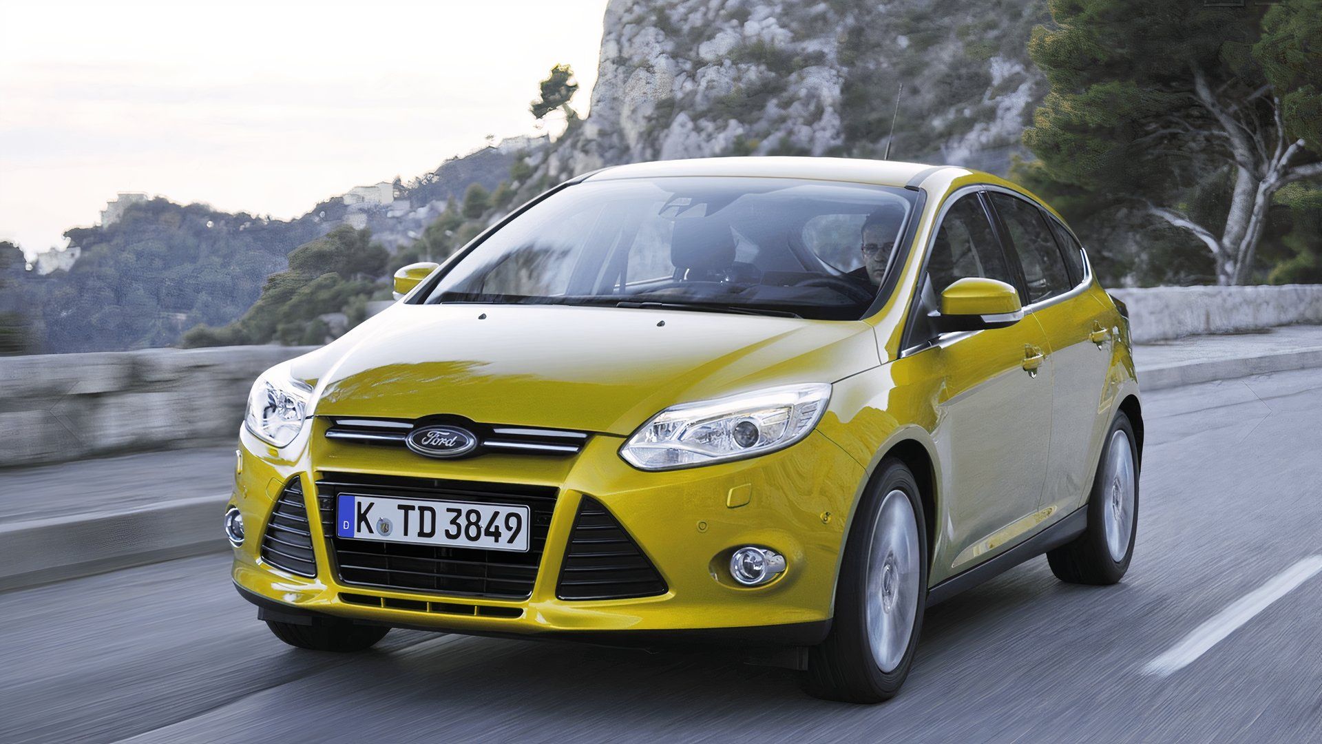 2012 Ford Focus Hatch Yellow Front Angle Driving