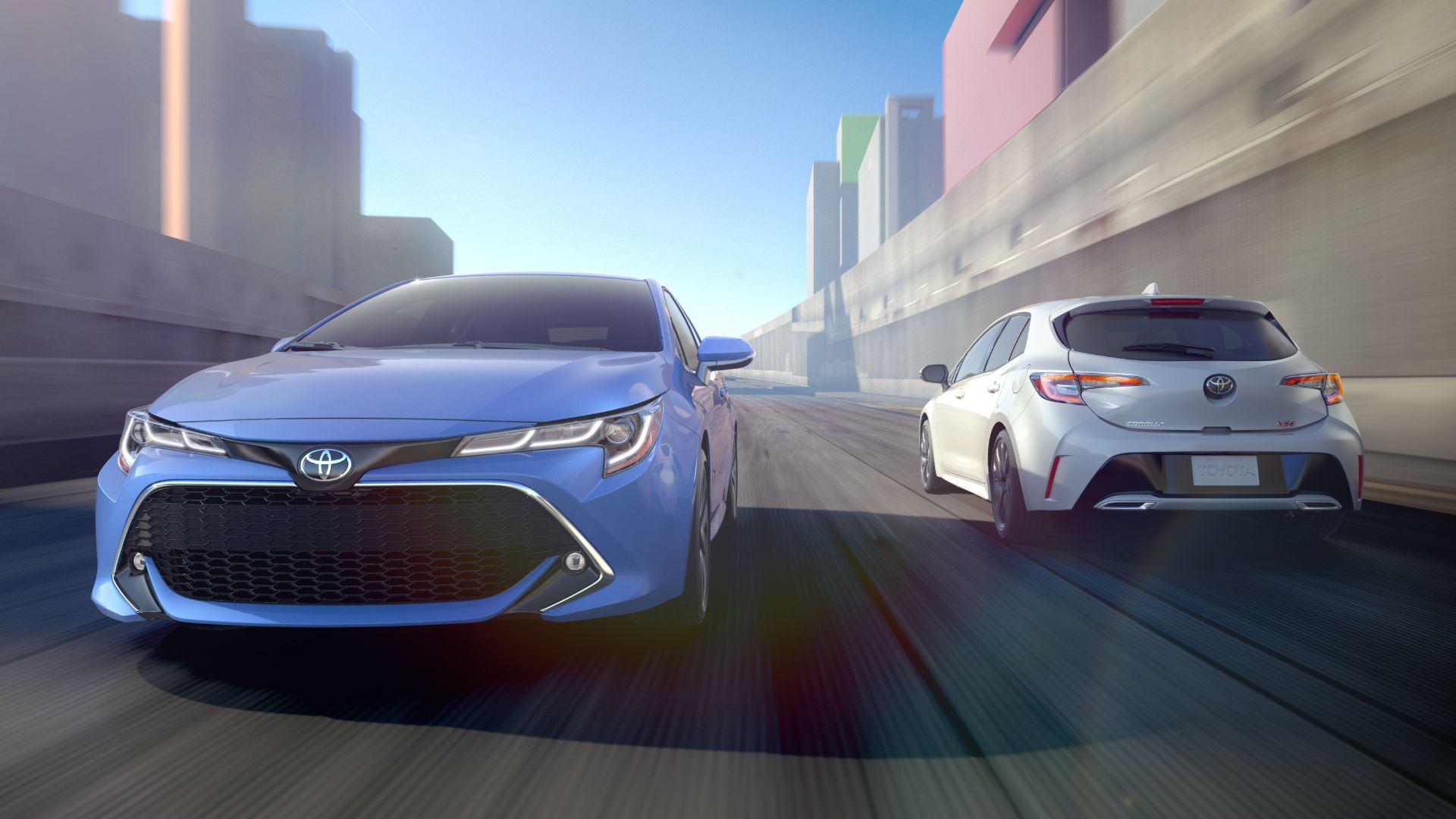 2019 Toyota Corolla Hatch x2 Blue Front White Rear Driving