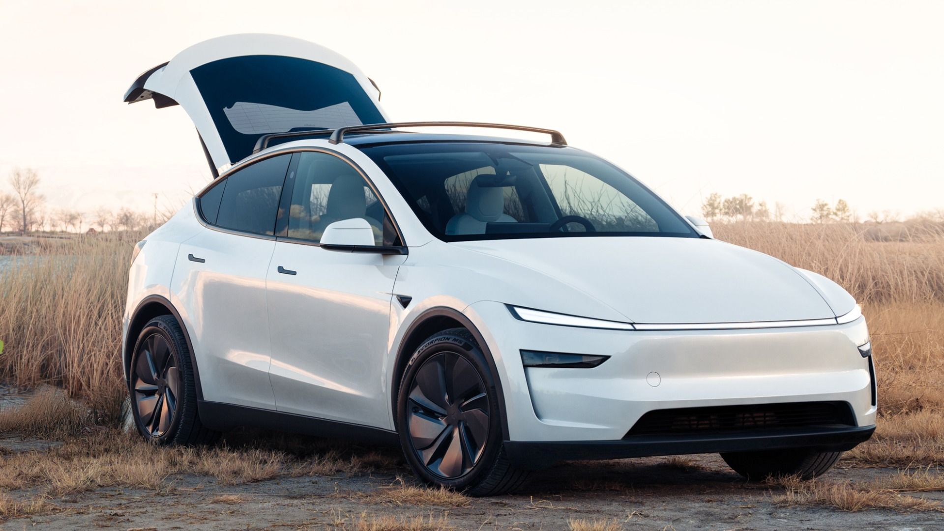 2026 Tesla Model Y White Front Angled View Trunk Open