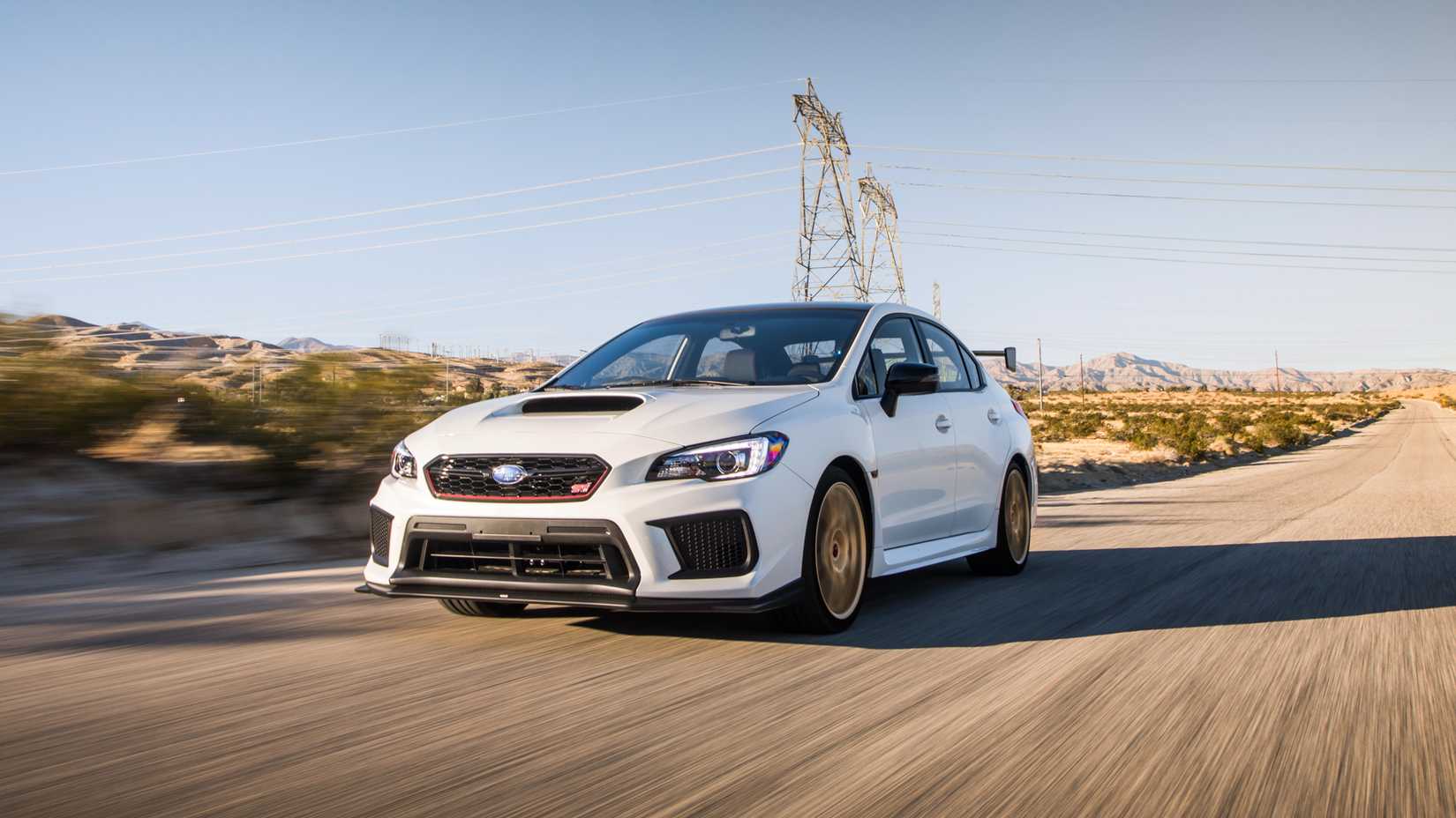 2018 Subaru WRX STI Type RA White Front Angled View Driving