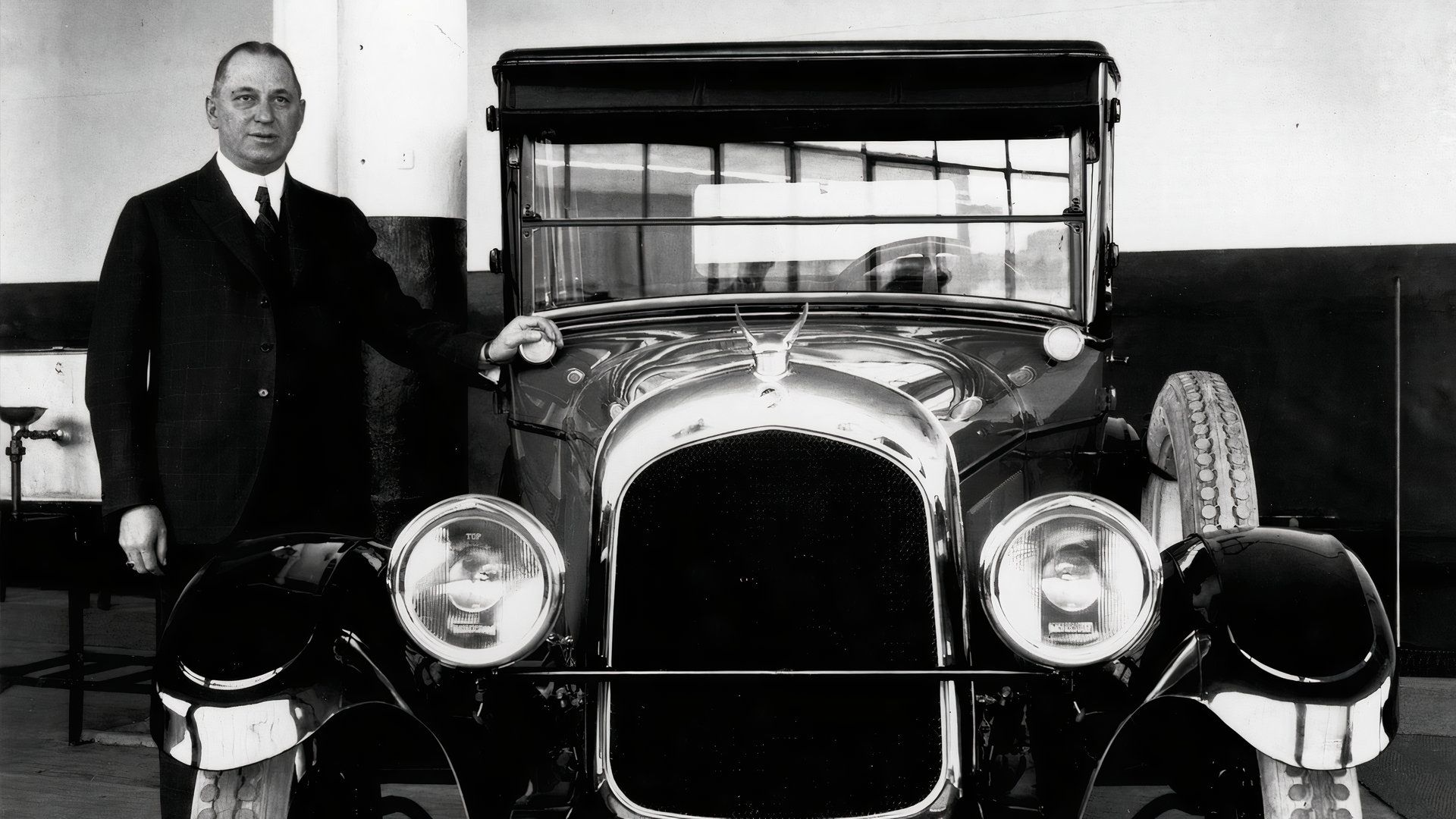 Walter P. Chrysler with original Chrysler Six indoors