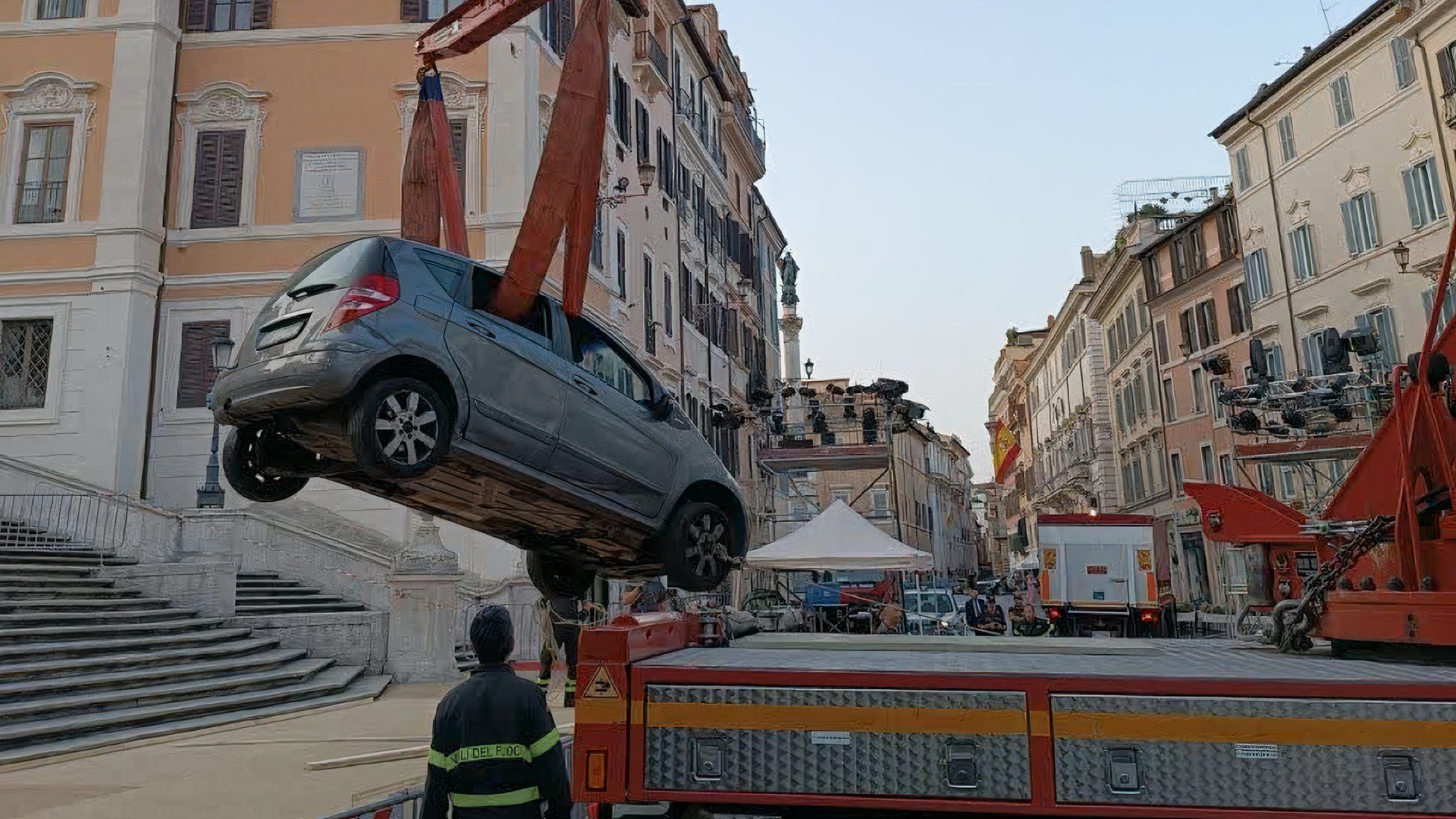 Roman firefighters remove a Mercedes A-Class from the Spanish Steps using a crane