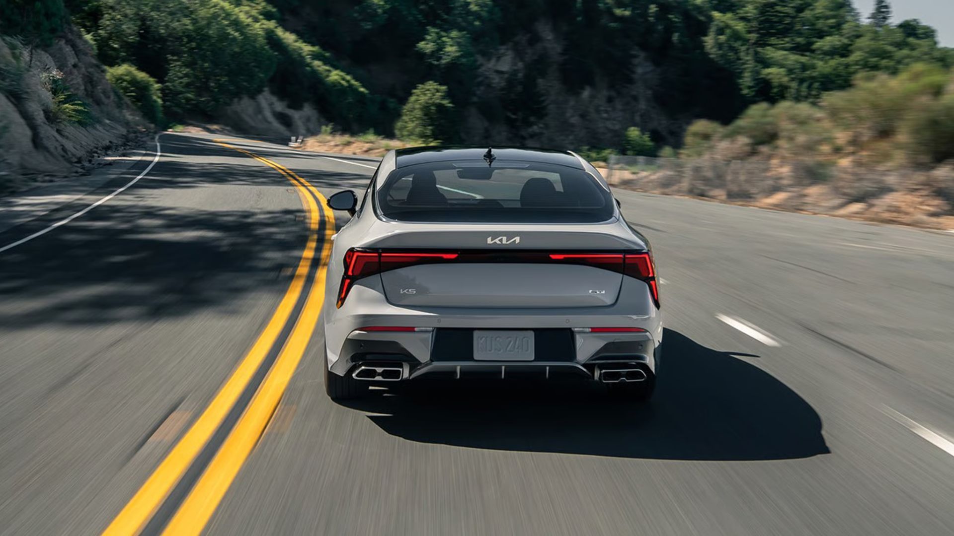 2026 Kia K5 exterior view highlighting a sporty, aerodynamic profile and fastback-like styling cues