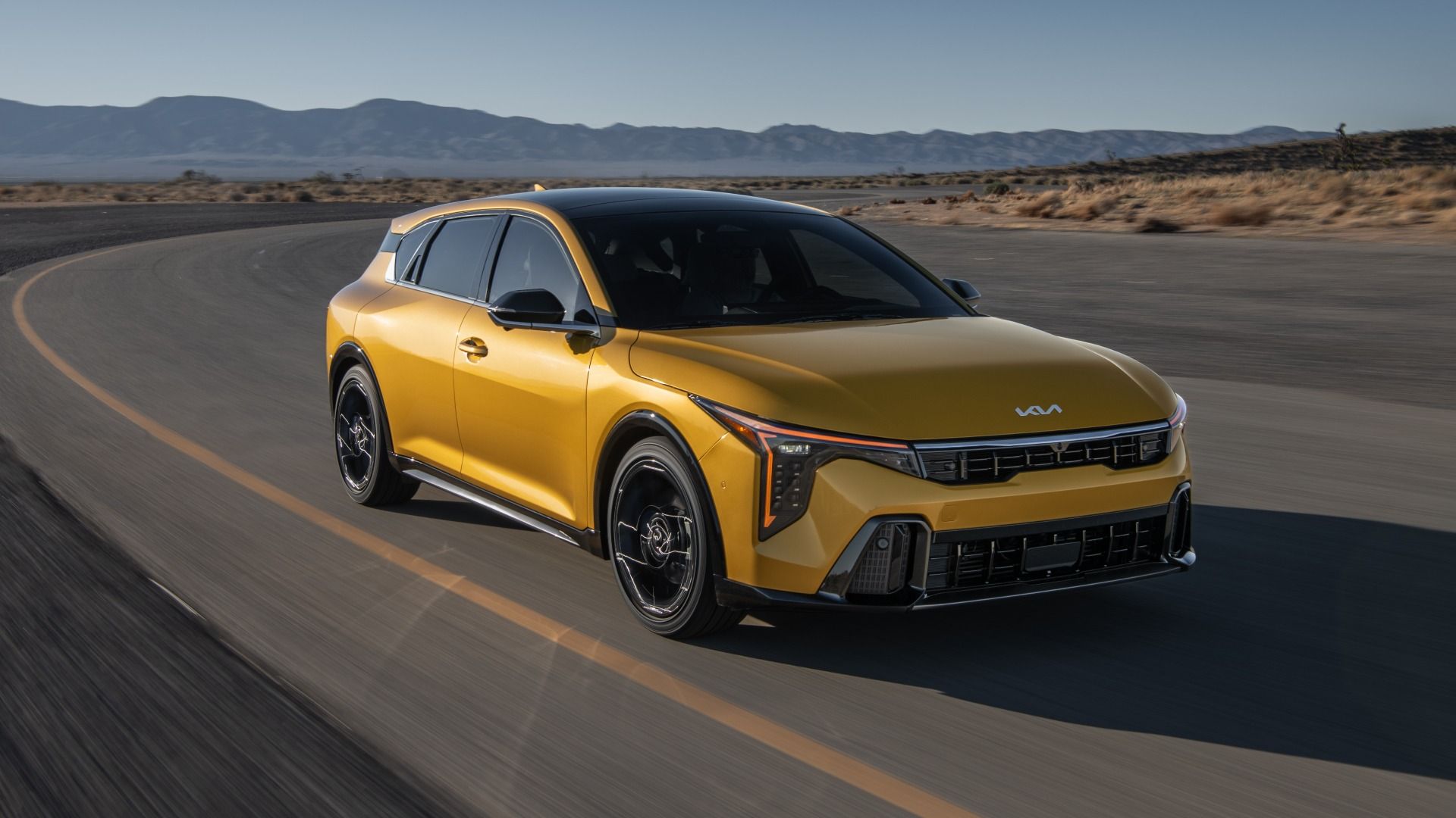 2026 Kia K4 Hatchback GT-Line Turbo in sparkling yellow, front three-quarter