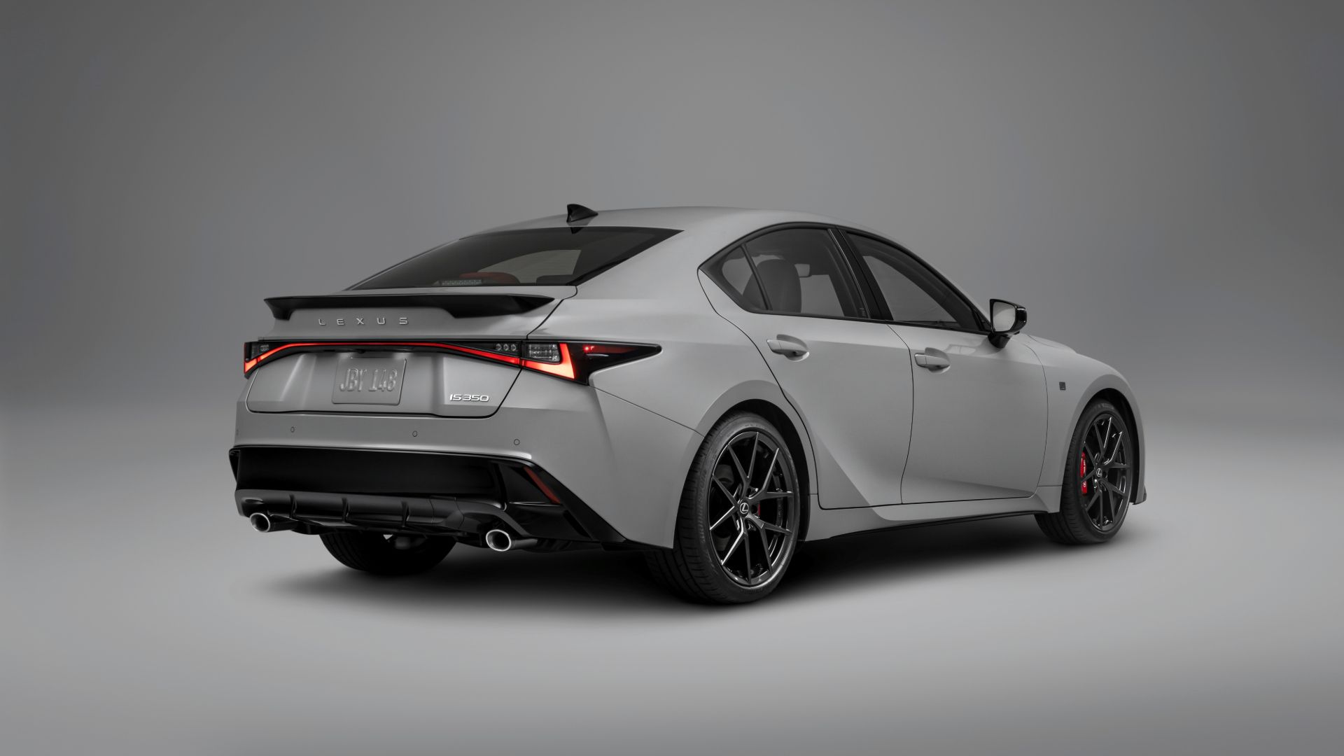 Rear three-quarter view shows refreshed lighting signature and dual exhausts.