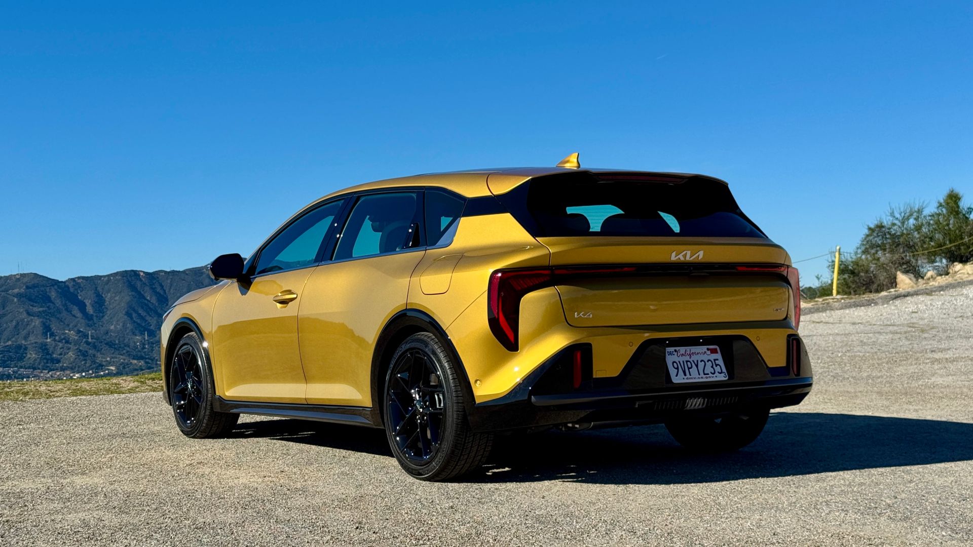 Rear three-quarter view with the K4 Hatchback's wide-stance tail lights