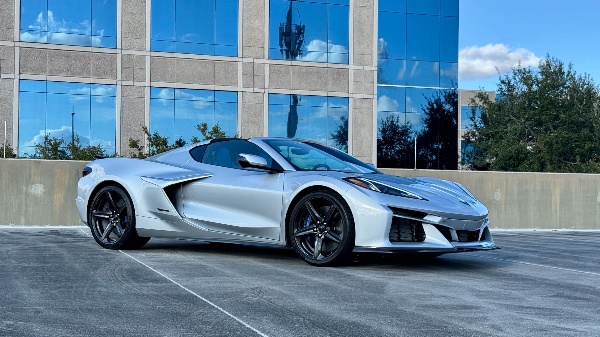 2026 Chevrolet Corvette E-Ray front three-quarter in Riptide Blue Metallic