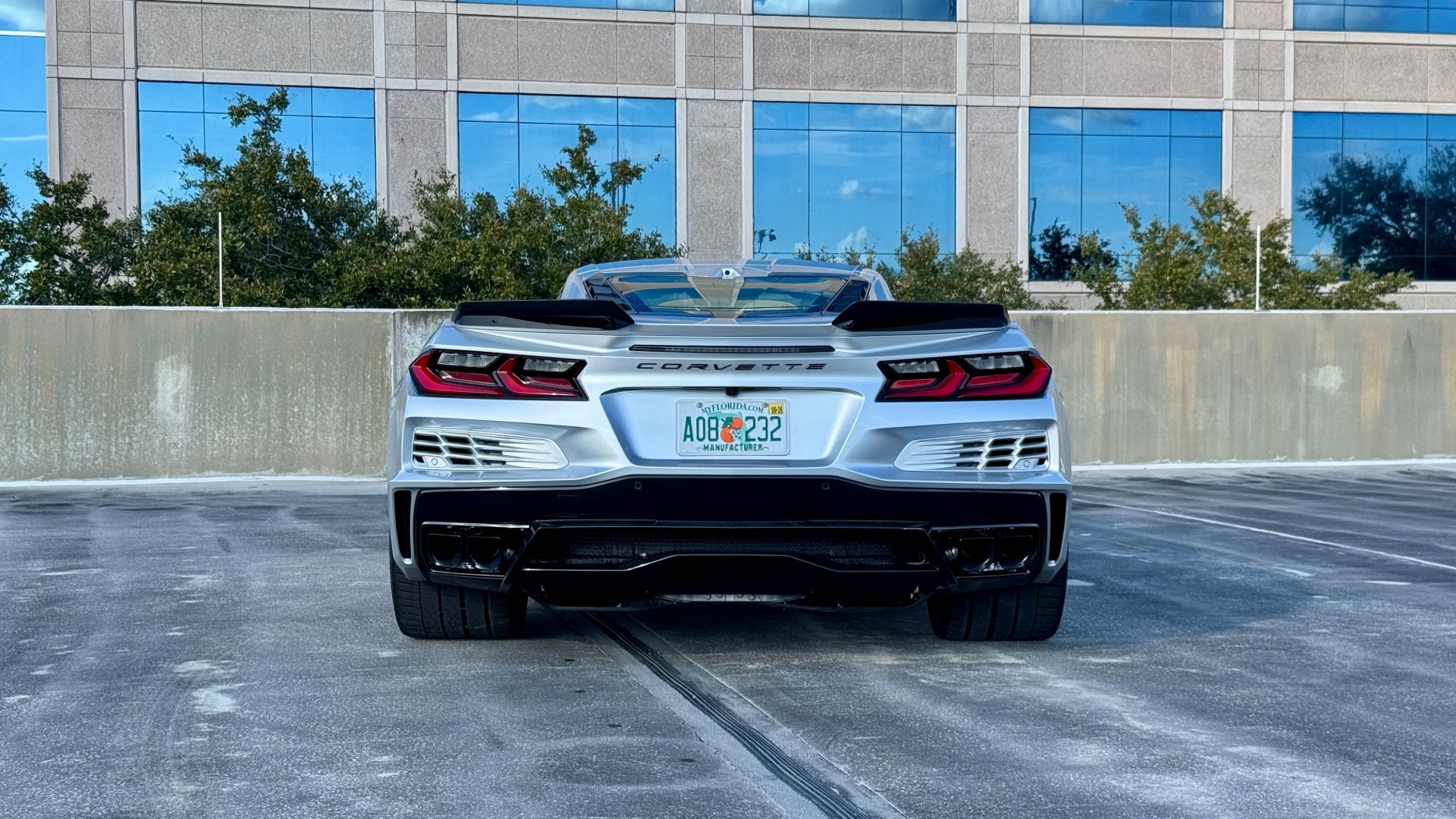 E-Ray rear quarter view showing dual side exhausts and Stingray emblem
