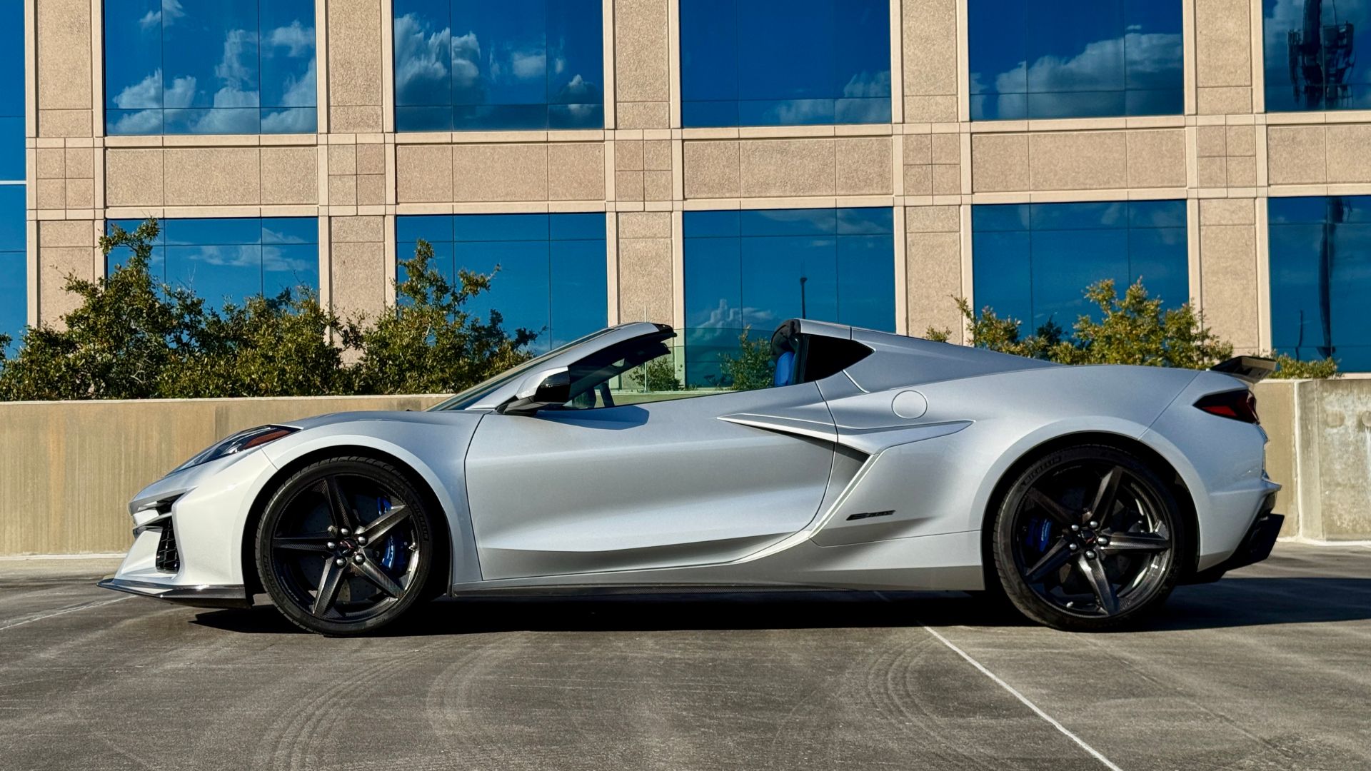 2026 Corvette E-Ray side profile showing wide rear haunches and ducktail spoiler