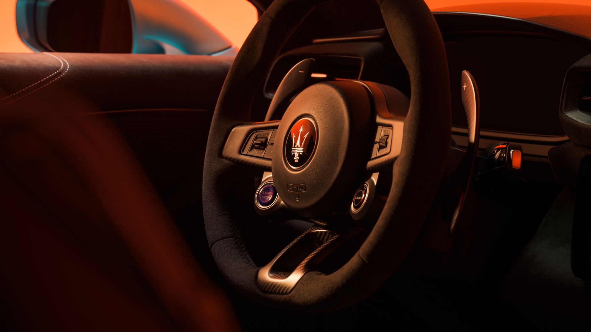 MCPura cockpit — flat-top steering wheel and dual 10.25-inch displays
