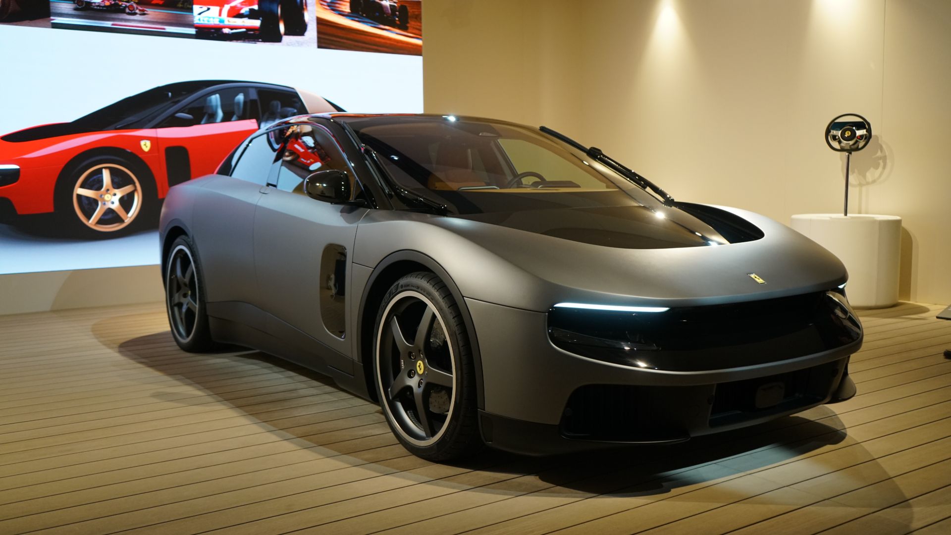 Ferrari Luce front three-quarter view at Goodwood Festival of Speed 2026, showing the long hood and floating wing design