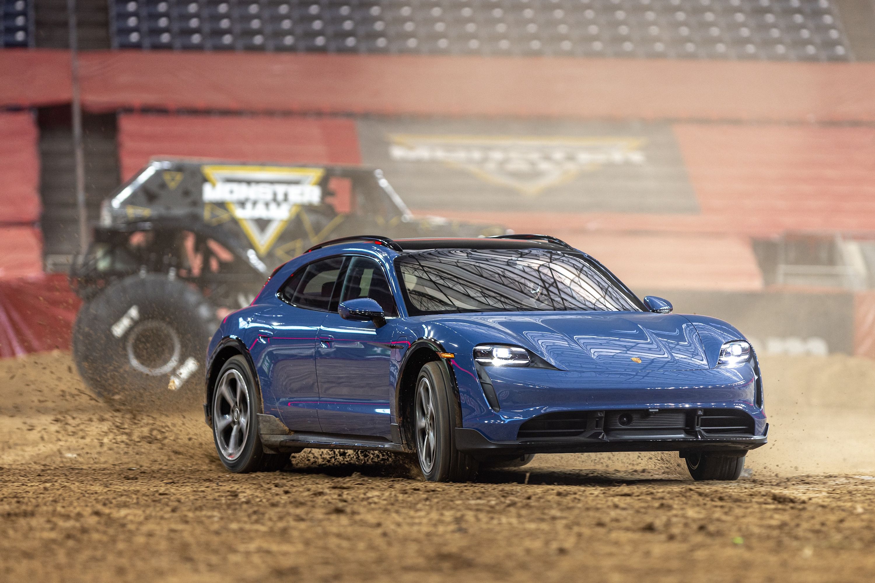 Watch A Porsche Taycan Turbo S Cross Turismo Race A Monster Jam Truck