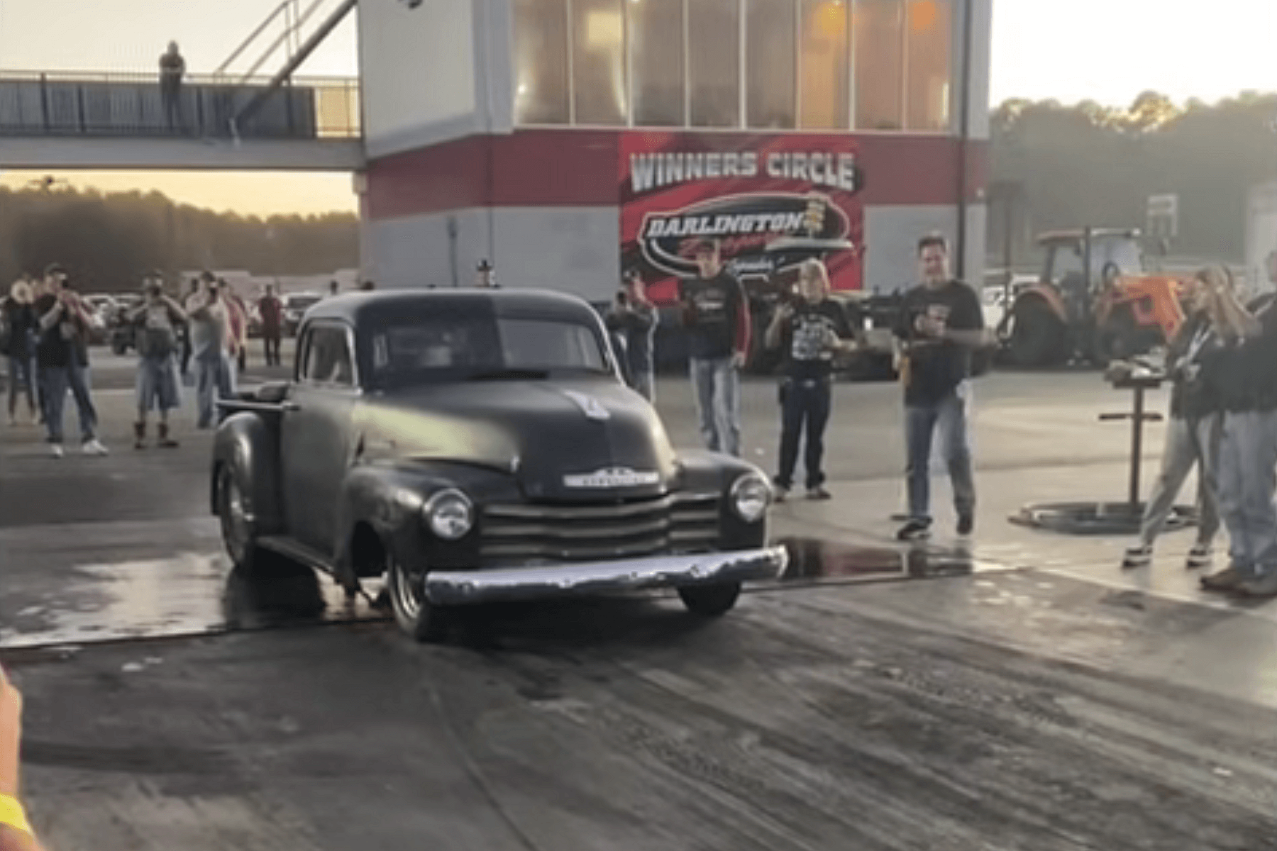 Watch: Man Goes For A Ride-Along On Drag Racing Truck's Bed