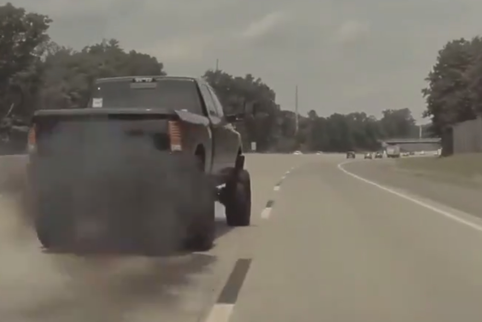 Watch This Moron Dangerously Coal Roll A Tesla