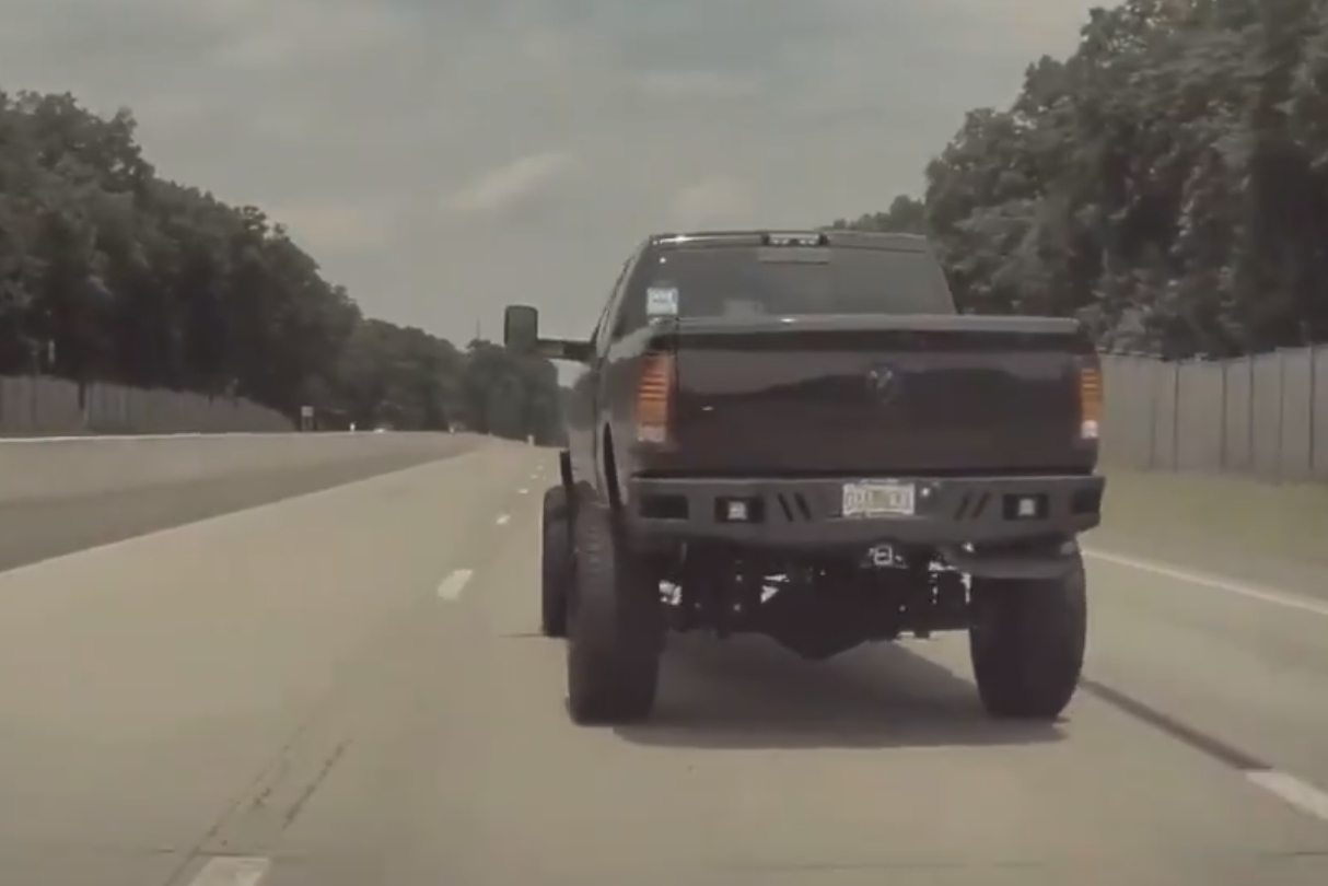 Watch This Moron Dangerously Coal Roll A Tesla
